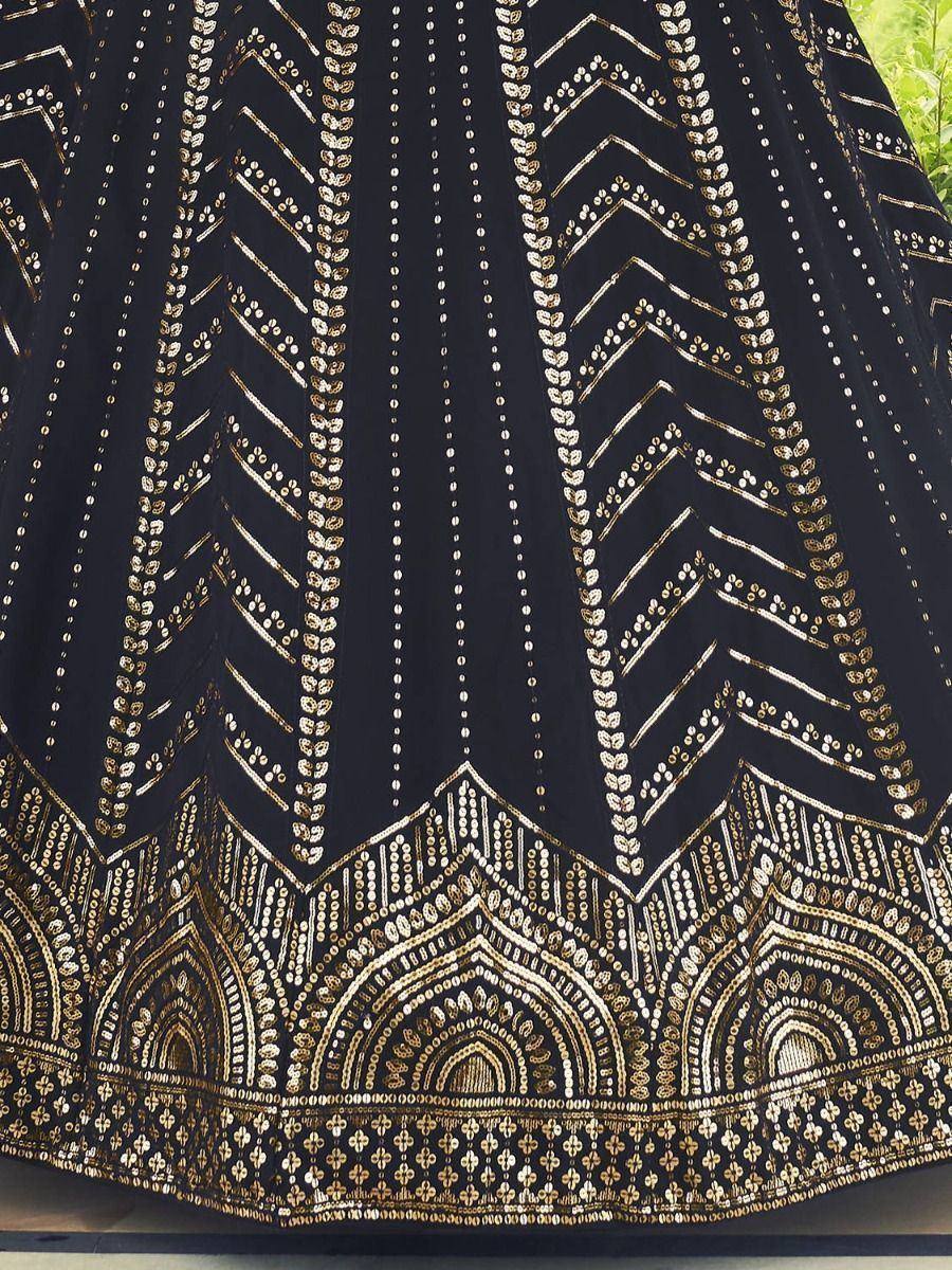 Black lehenga with gold embroidery and geometric patterns, ethnic Indian wear