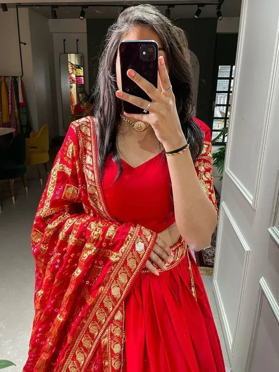 Red designer lehenga choli with gold embroidery, perfect for Indian ethnic wear occasions