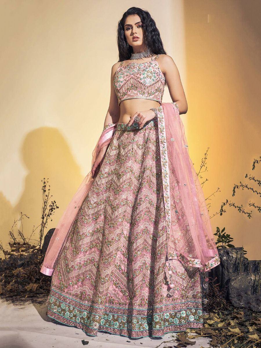 Pink embroidered lehenga choli with floral motifs, perfect for Indian ethnic wear and festive occasions.