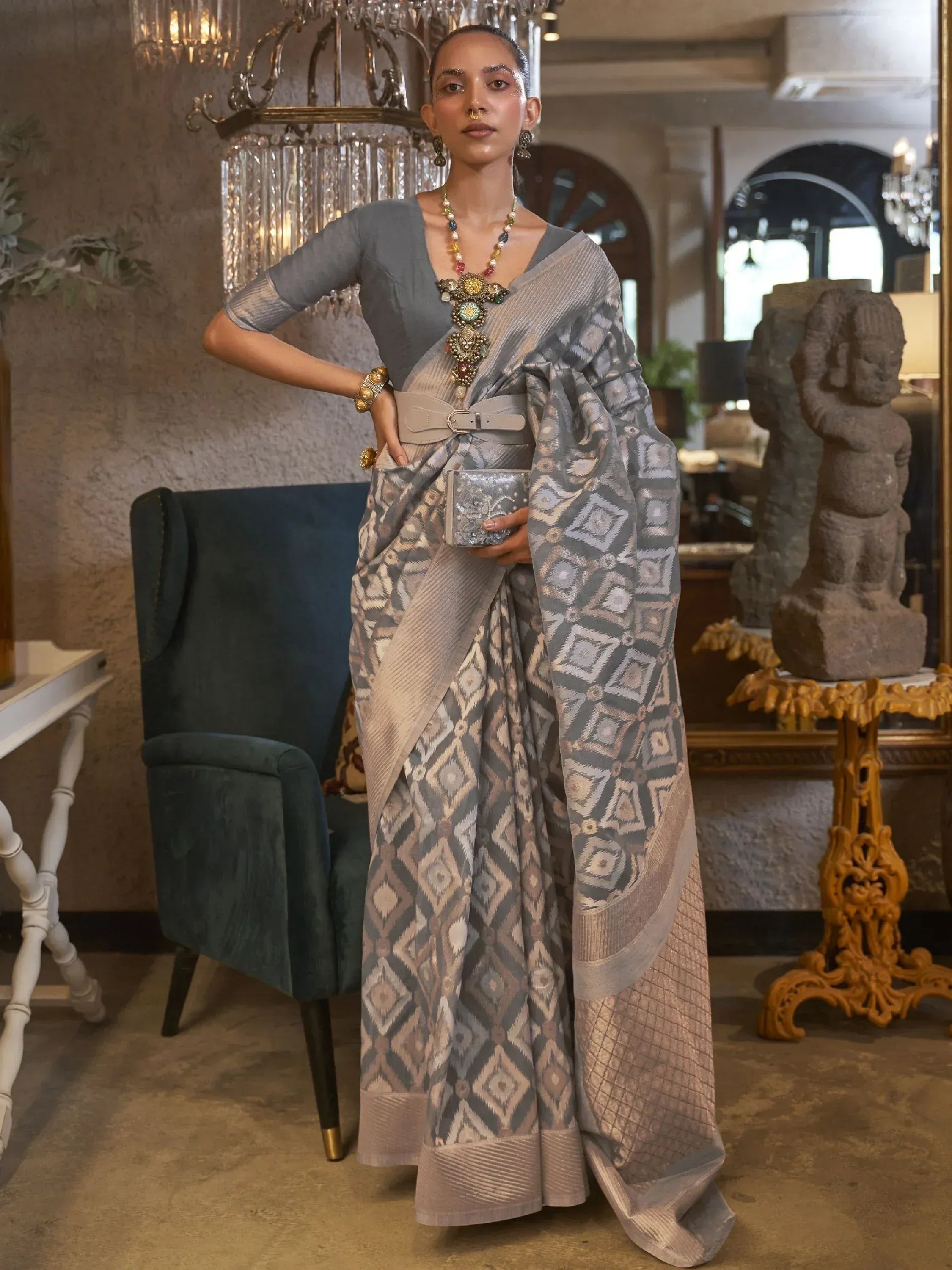 Grey geometric pattern saree with belt, styled with statement jewelry for ethnic wear