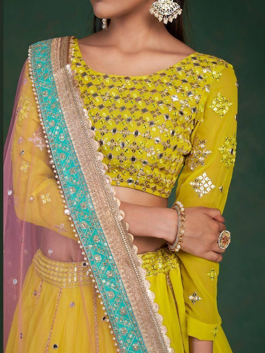 Yellow designer lehenga choli with mirror work and turquoise dupatta, ethnic Indian wear