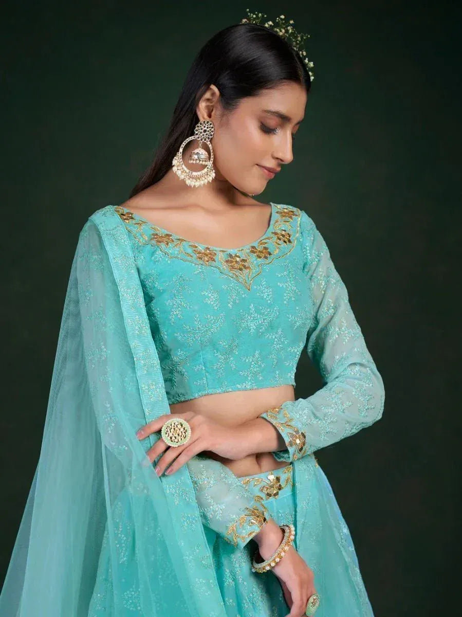Turquoise designer lehenga choli with gold embroidery, perfect for Indian ethnic wear occasions