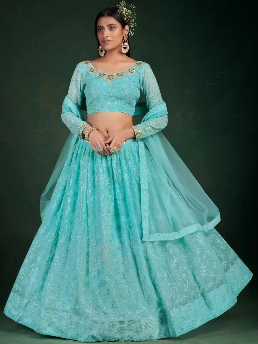Turquoise designer lehenga choli with gold embroidery, perfect for Indian ethnic wear events
