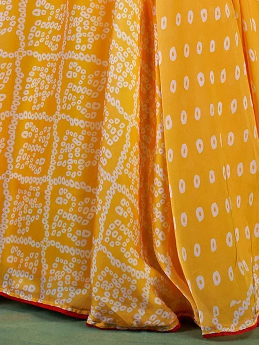 Yellow ethnic gown with white geometric print and red hem, perfect for Indian occasions