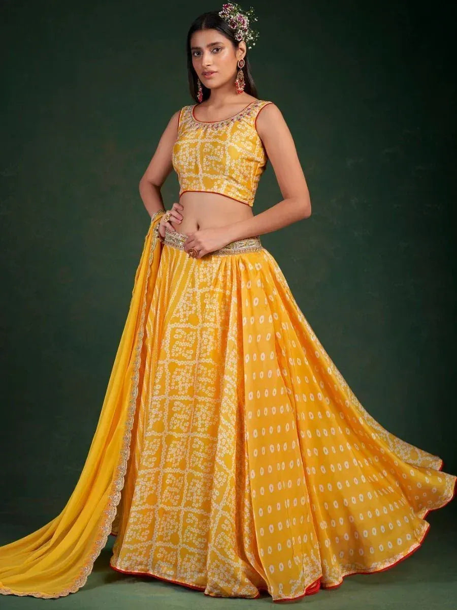 Yellow printed lehenga choli with floral hair accessory, perfect for Indian ethnic wear occasions