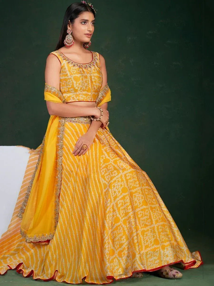 Yellow printed lehenga choli with gold embroidery, perfect for Indian ethnic wear and festive occasions