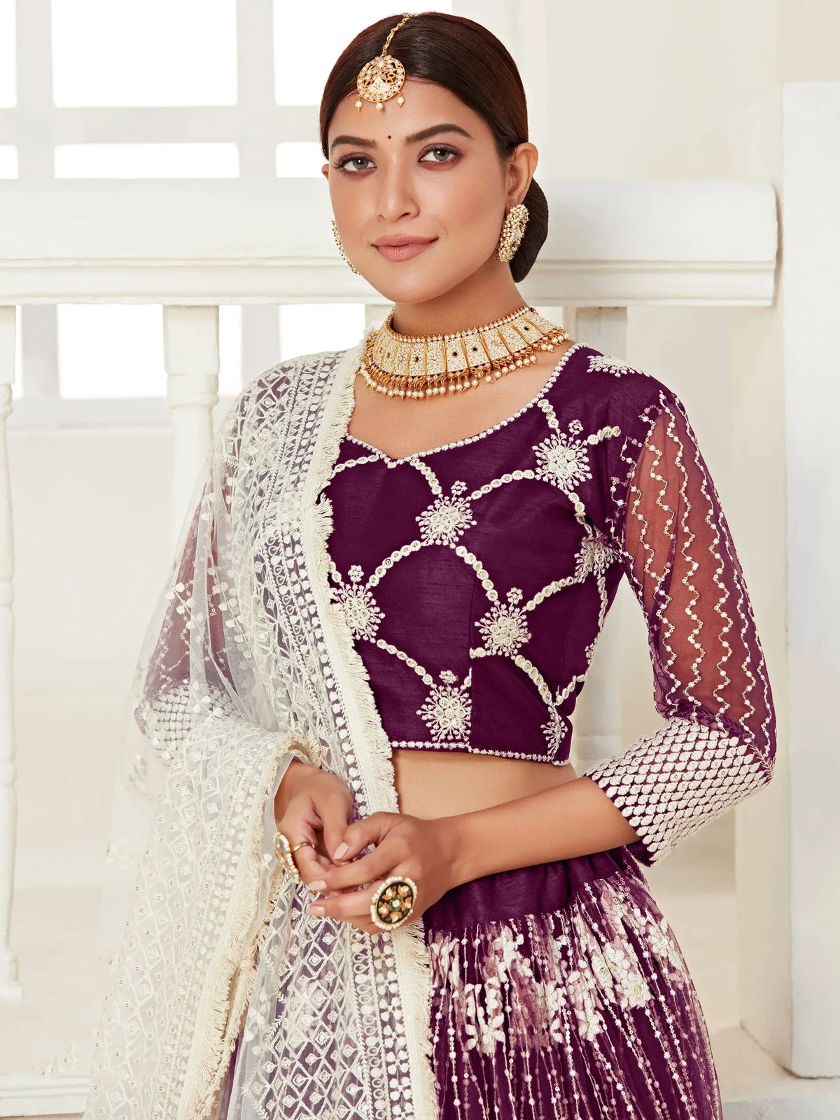 Purple embroidered lehenga choli with white dupatta, perfect for Indian ethnic wear occasions