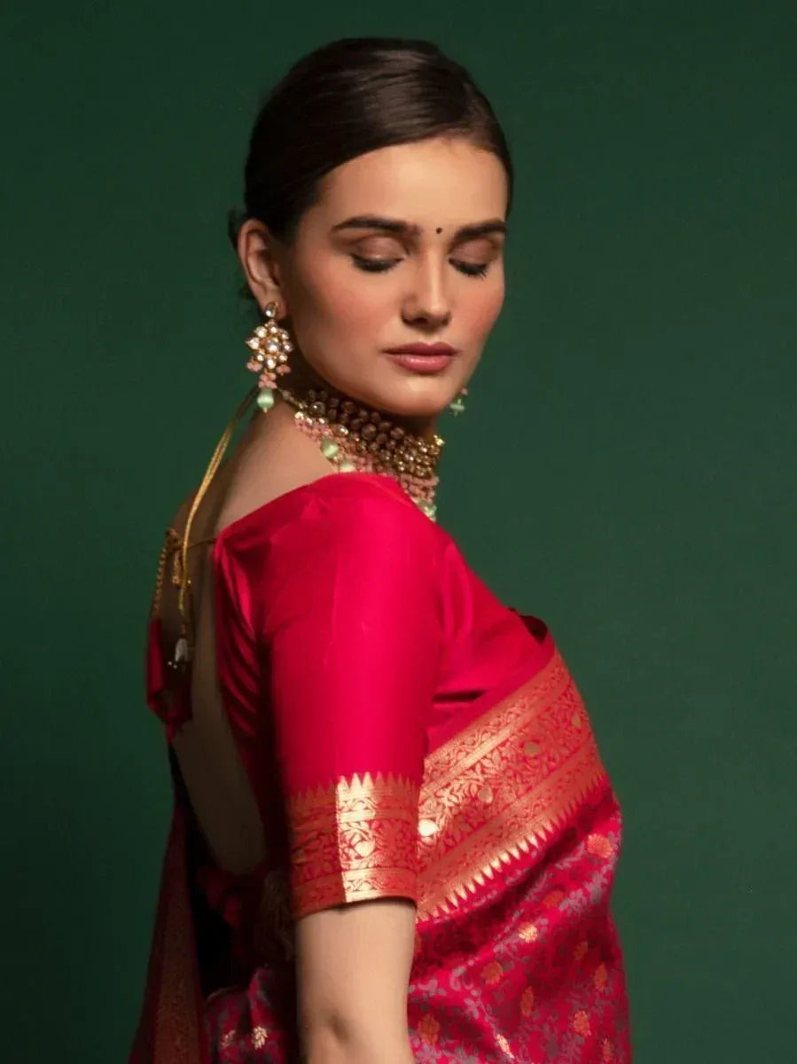 Red designer saree with gold border, ethnic jewelry, perfect for Indian weddings or festivals