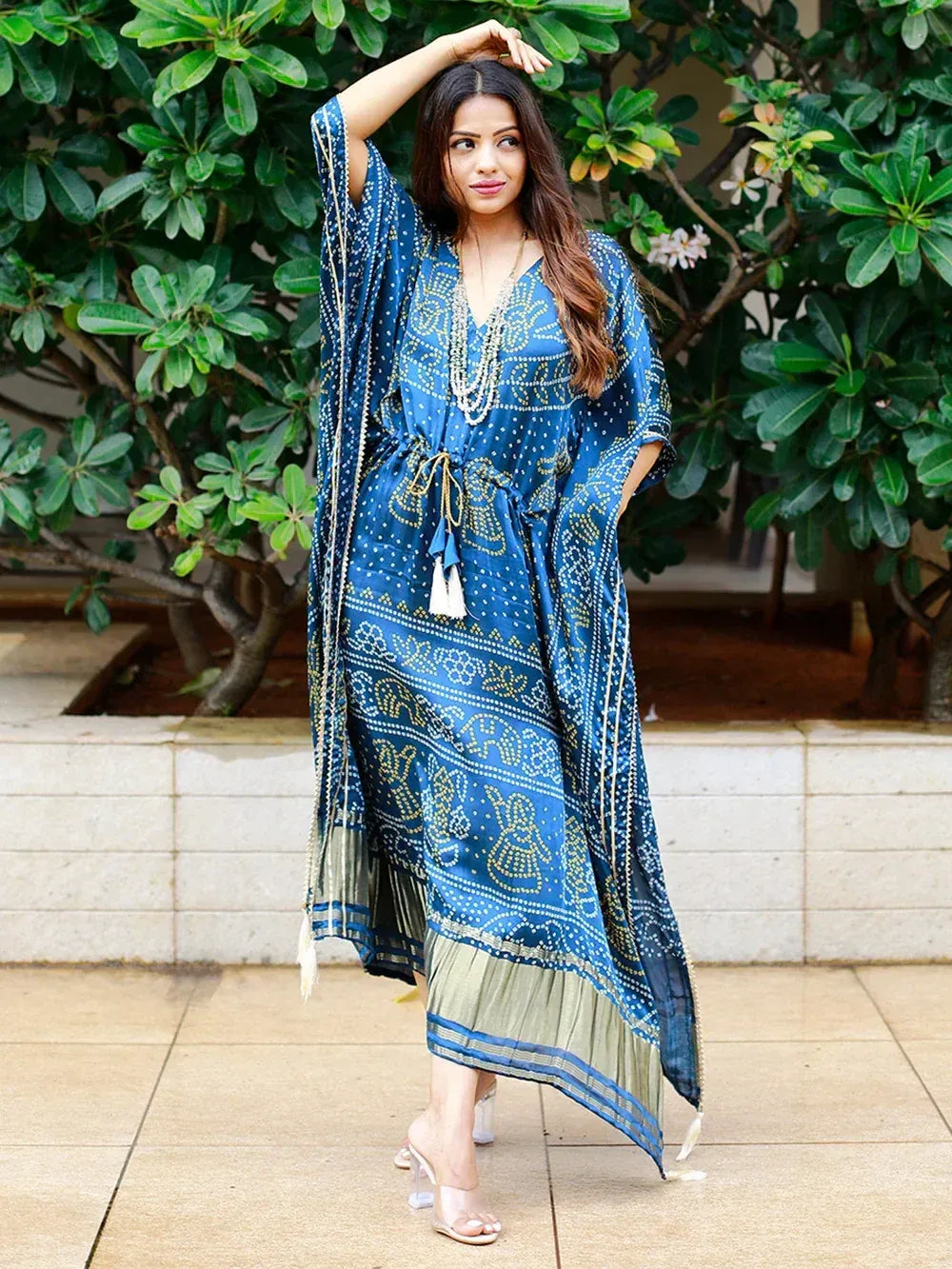 Blue printed ethnic gown with elephant motifs, tassels, and pleated hem, styled for women
