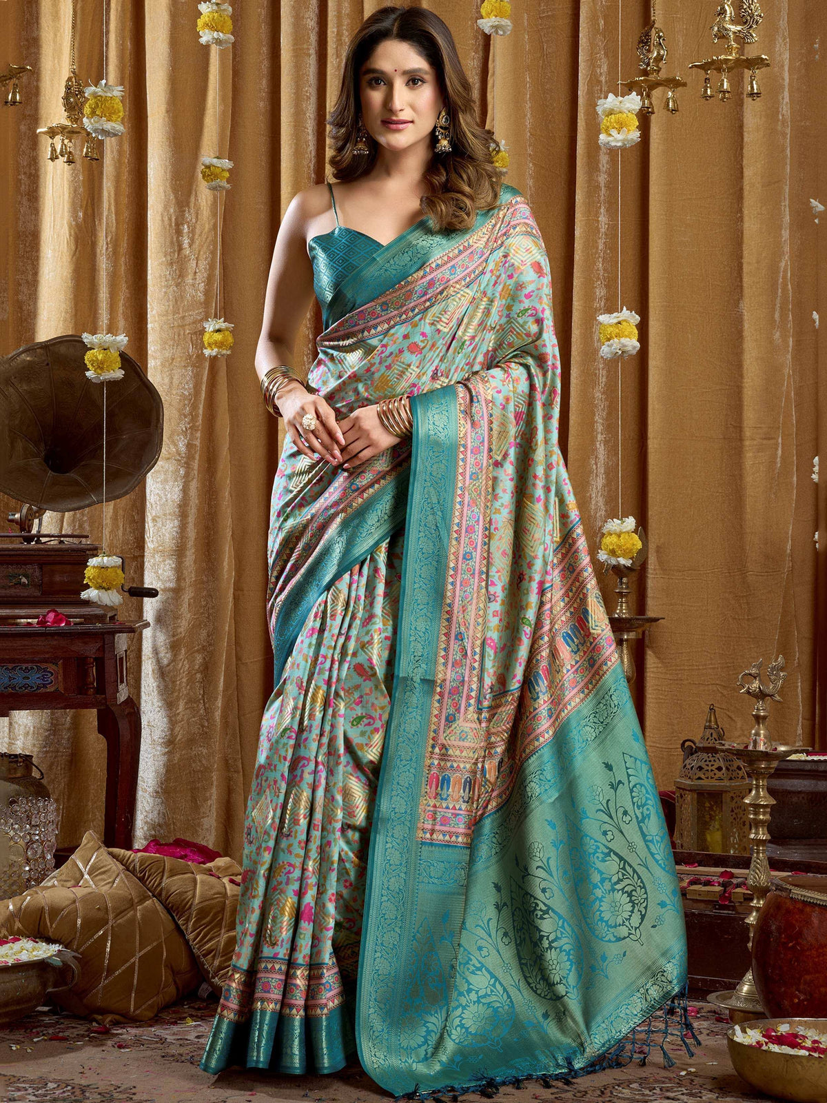 Teal floral printed saree with intricate border, perfect for Indian ethnic wear occasions