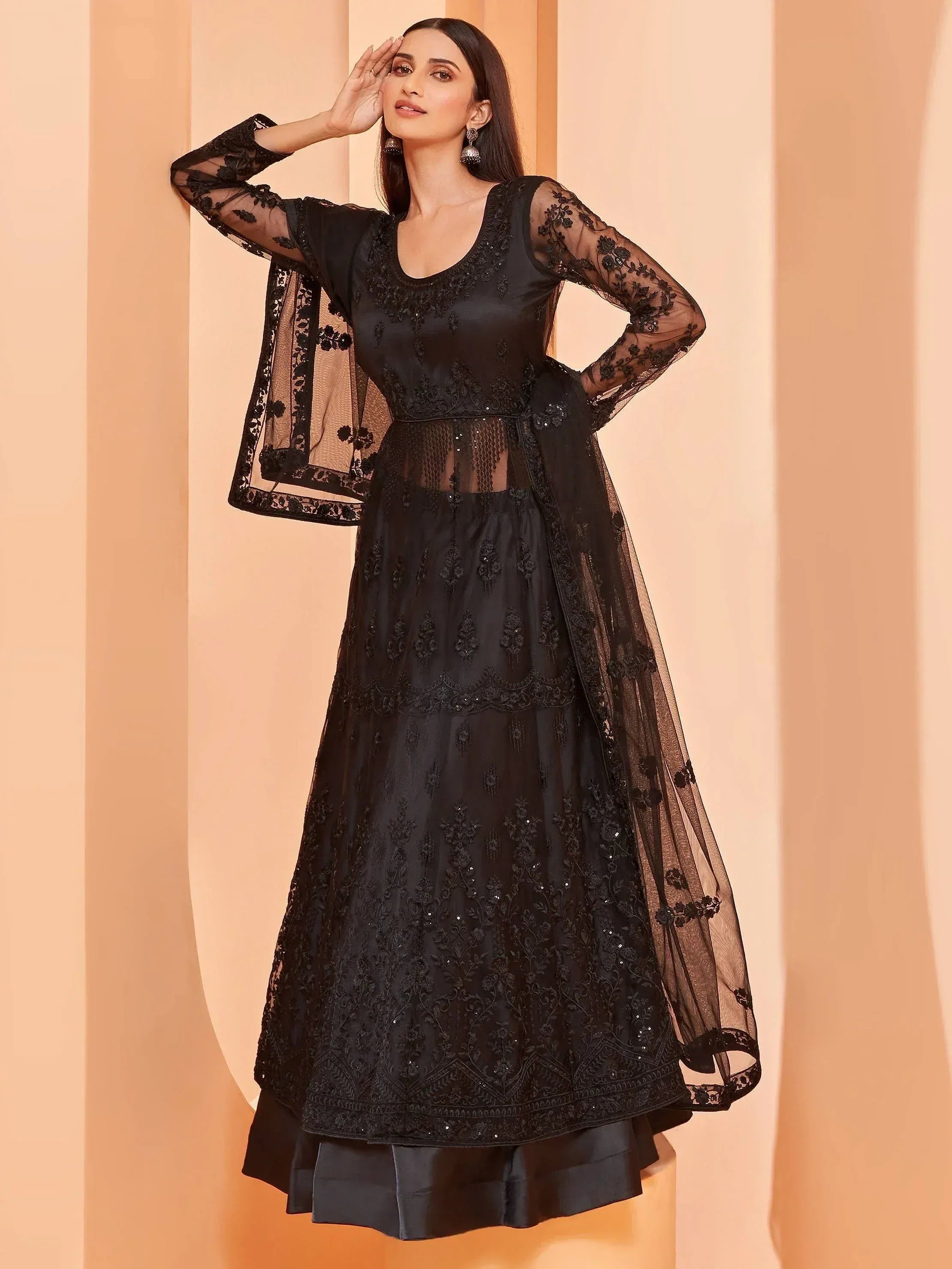 Elegant black embroidered anarkali with sheer lace sleeves and dupatta, perfect for Indian ethnic occasions.