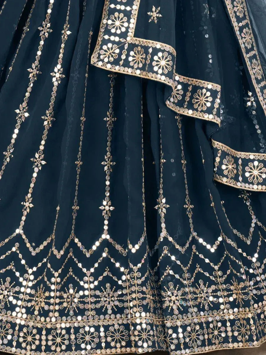 Dark blue lehenga with gold mirror work and intricate embroidery, perfect for Indian ethnic wear