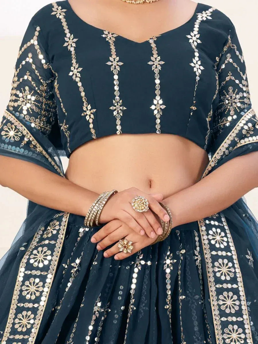 Dark blue designer lehenga choli with gold mirror work and floral embroidery, perfect for Indian ethnic wear.