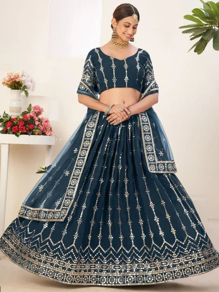 Elegant navy blue lehenga choli with gold embroidery, perfect for Indian ethnic wear occasions