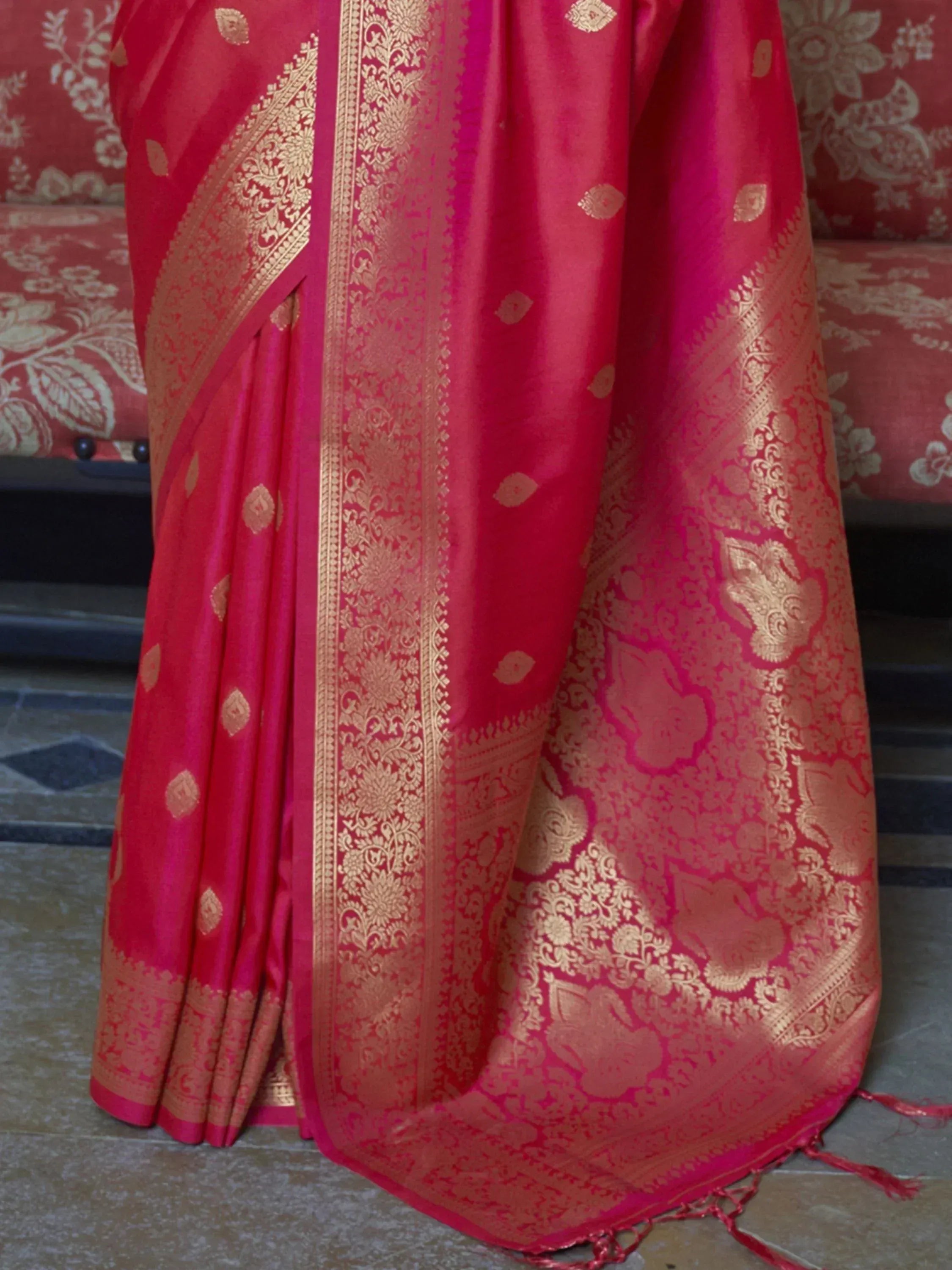 Rich red silk saree with gold zari floral and paisley motifs, perfect for Indian ethnic wear occasions