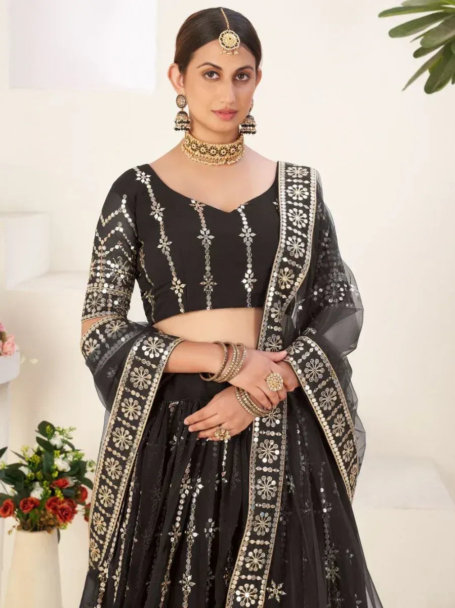 Black embroidered lehenga choli with gold mirror work, perfect for Indian ethnic wear occasions