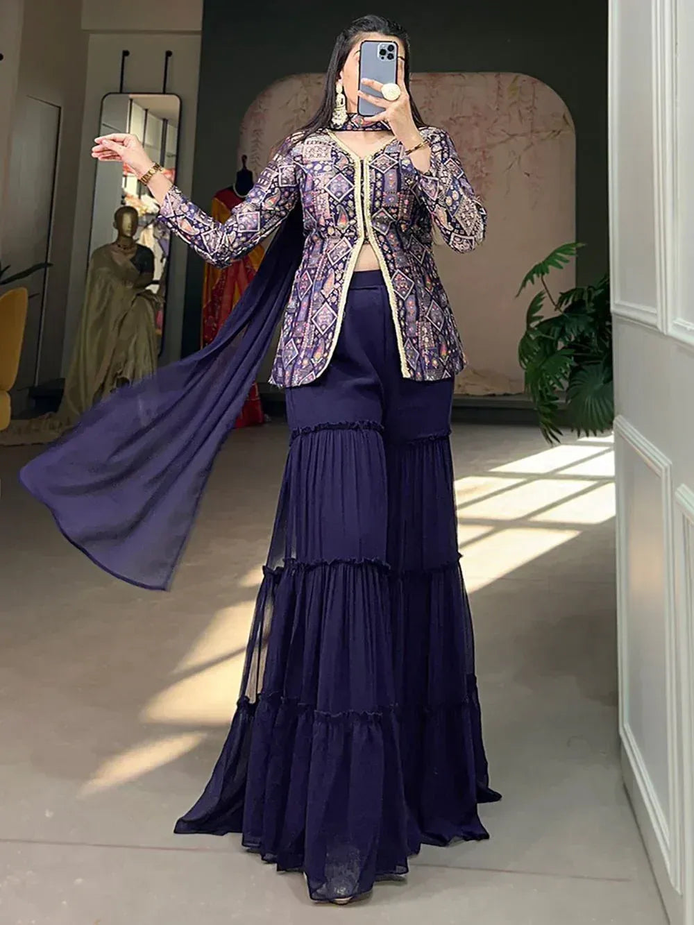 Woman in navy blue tiered palazzo pants with printed jacket and dupatta, ethnic wear outfit
