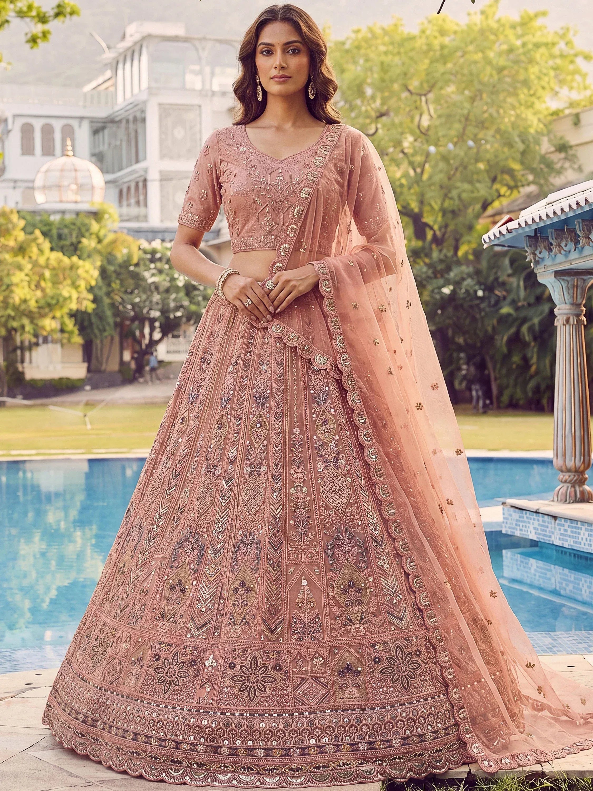 Glowing Peach Embroidered Net Wedding Wear Lehenga Choli with Dupatta