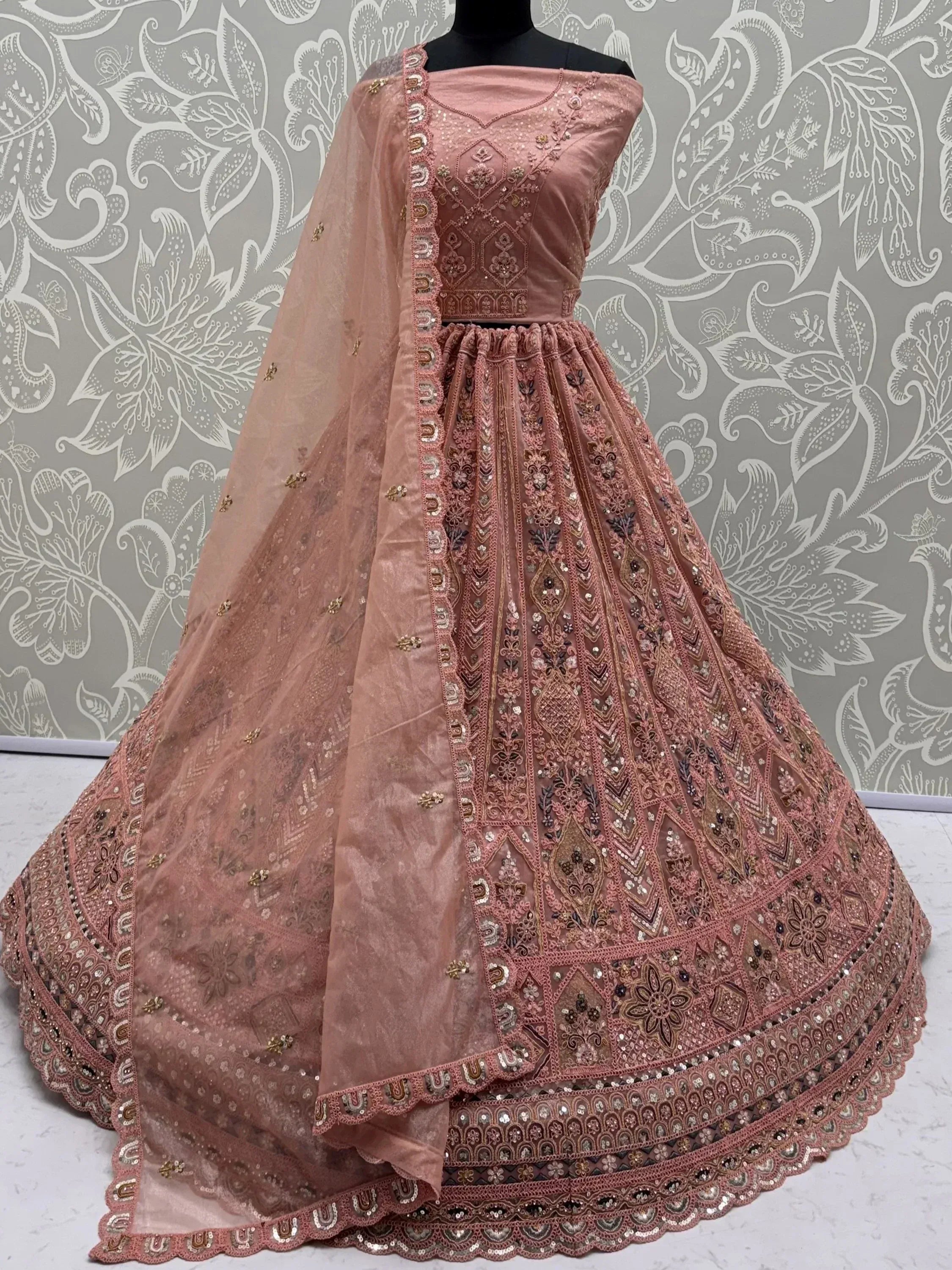 Glowing Peach Embroidered Net Wedding Wear Lehenga Choli with Dupatta