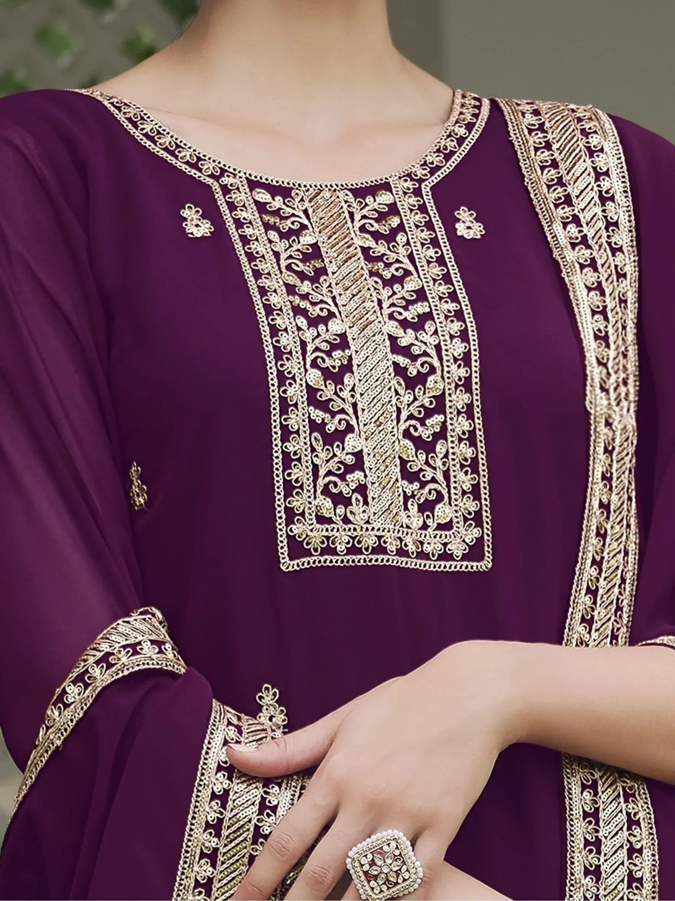 Purple ethnic kurta with gold embroidery, traditional Indian party wear details visible
