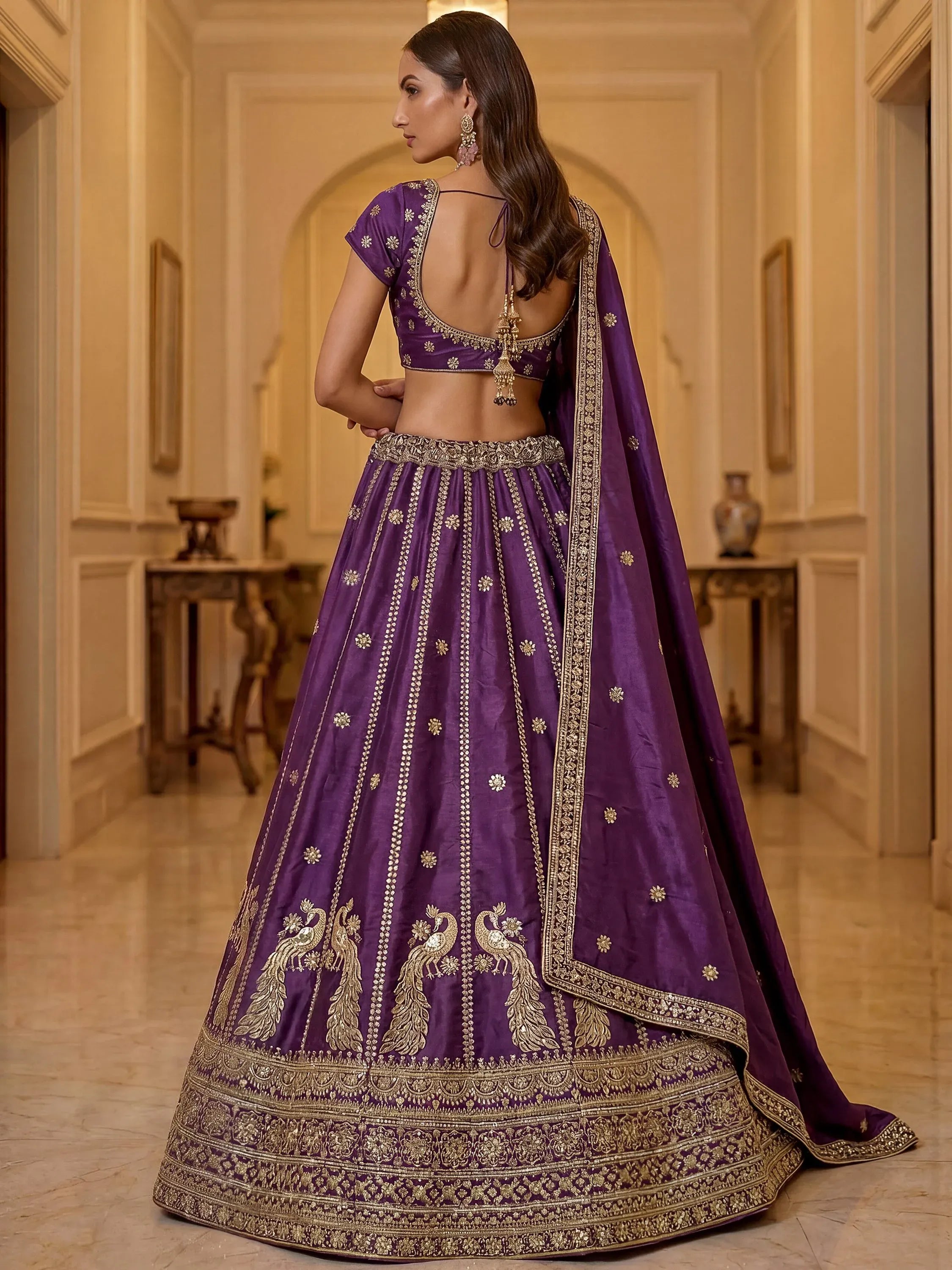 Wondrous Purple Embroidered Silk Reception Wear Lehenga Choli