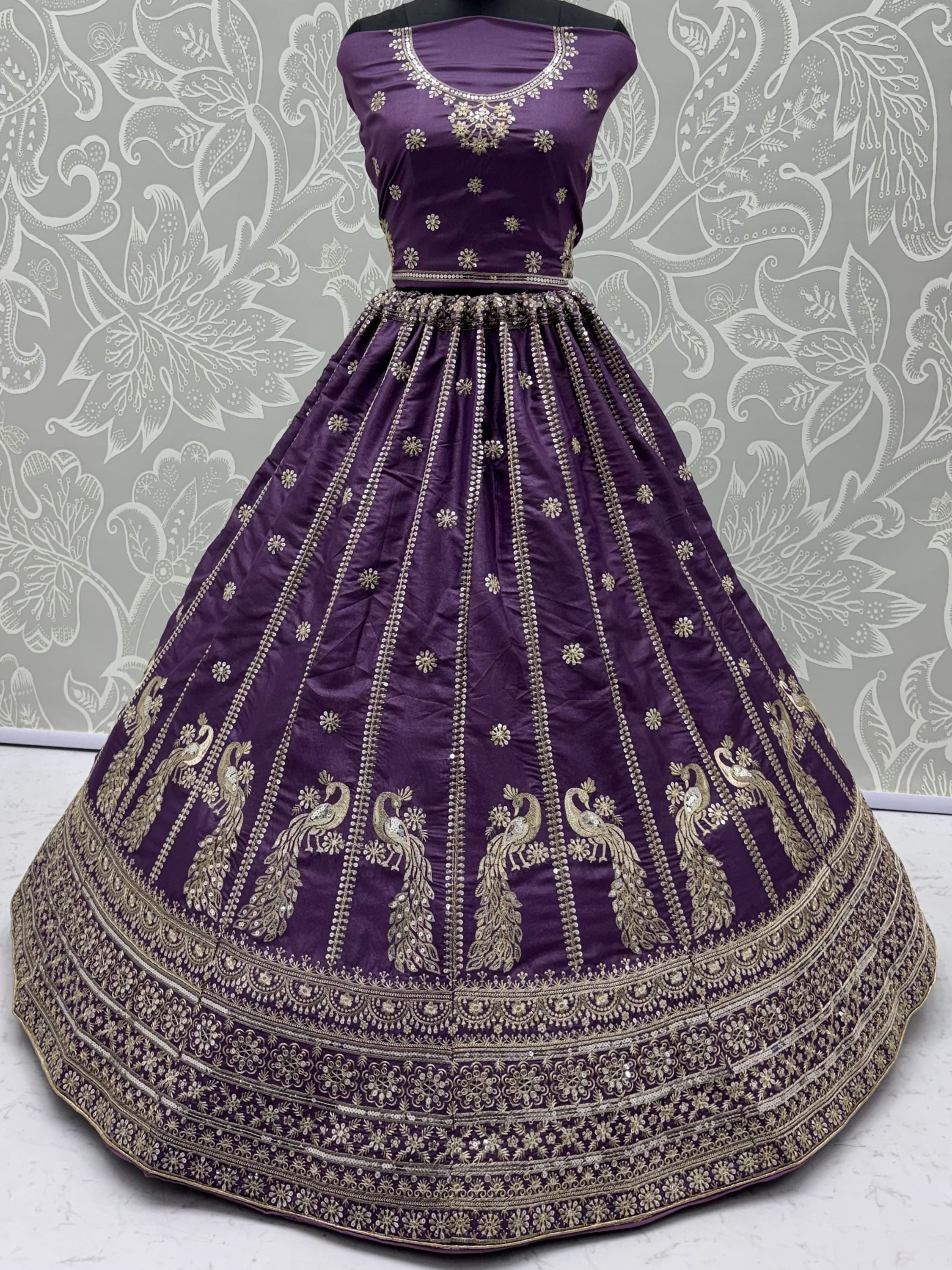 Wondrous Purple Embroidered Silk Reception Wear Lehenga Choli