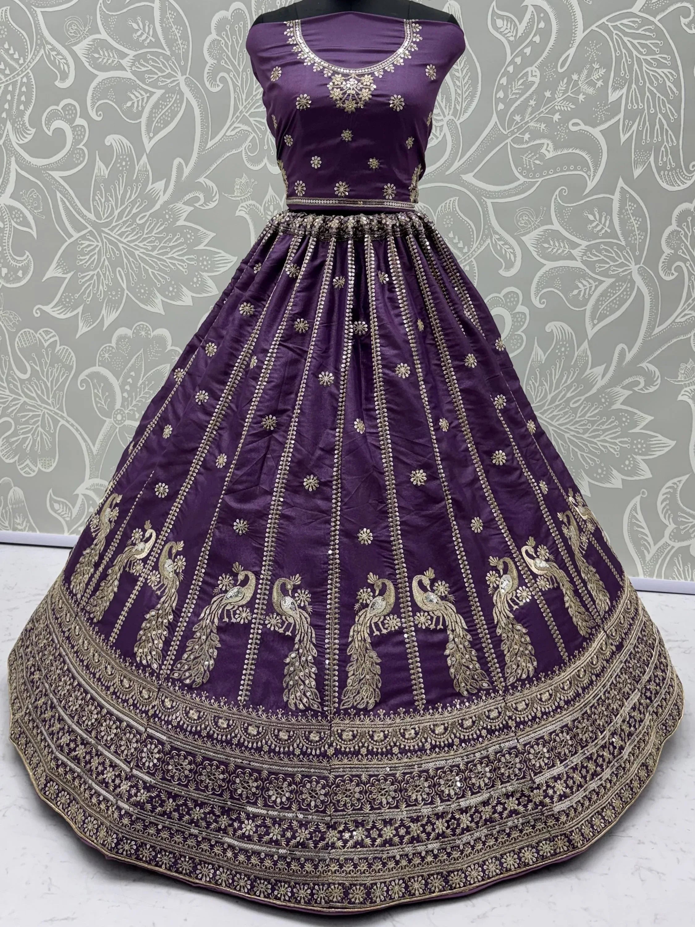Wondrous Purple Embroidered Silk Reception Wear Lehenga Choli