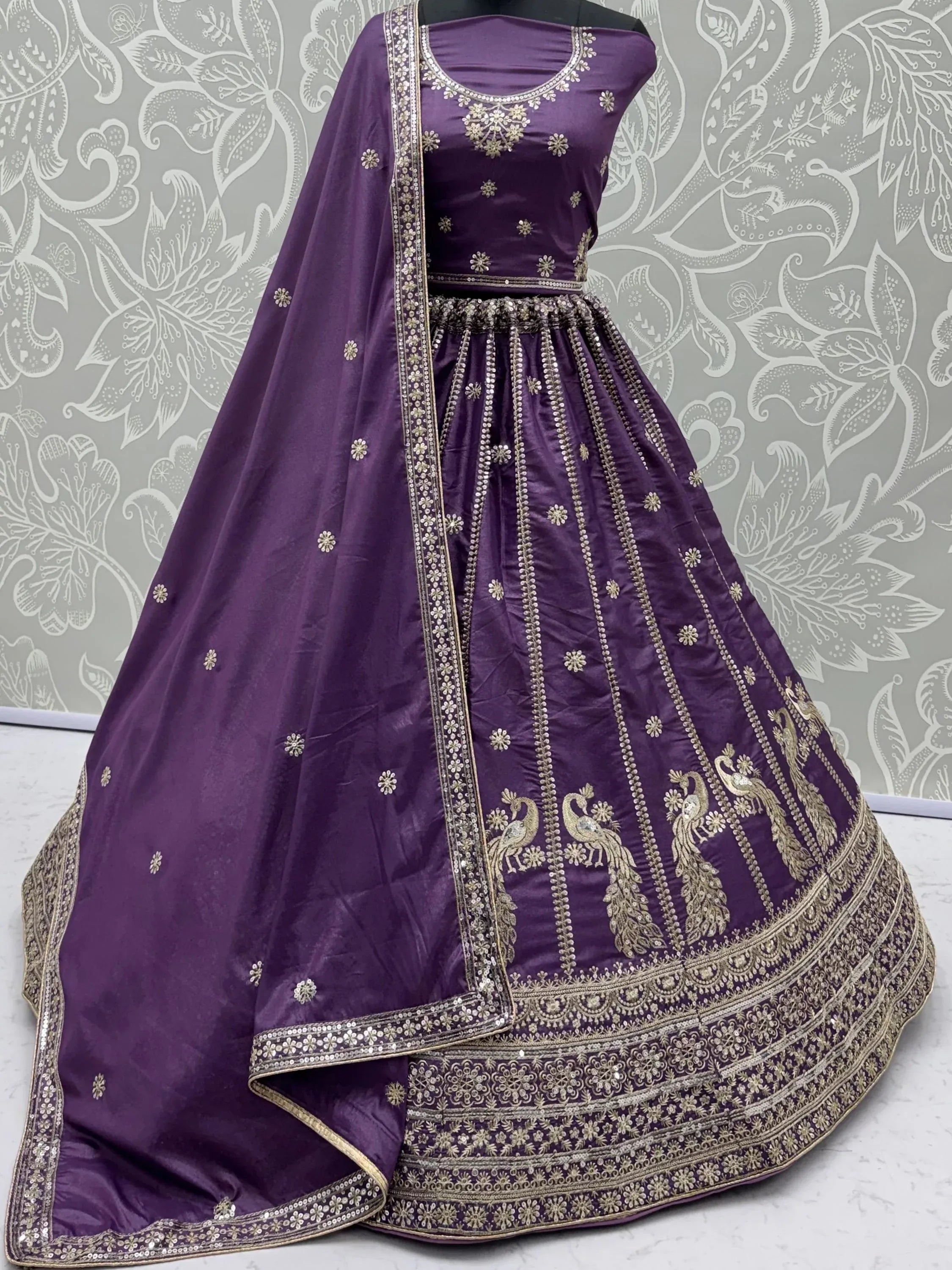 Wondrous Purple Embroidered Silk Reception Wear Lehenga Choli