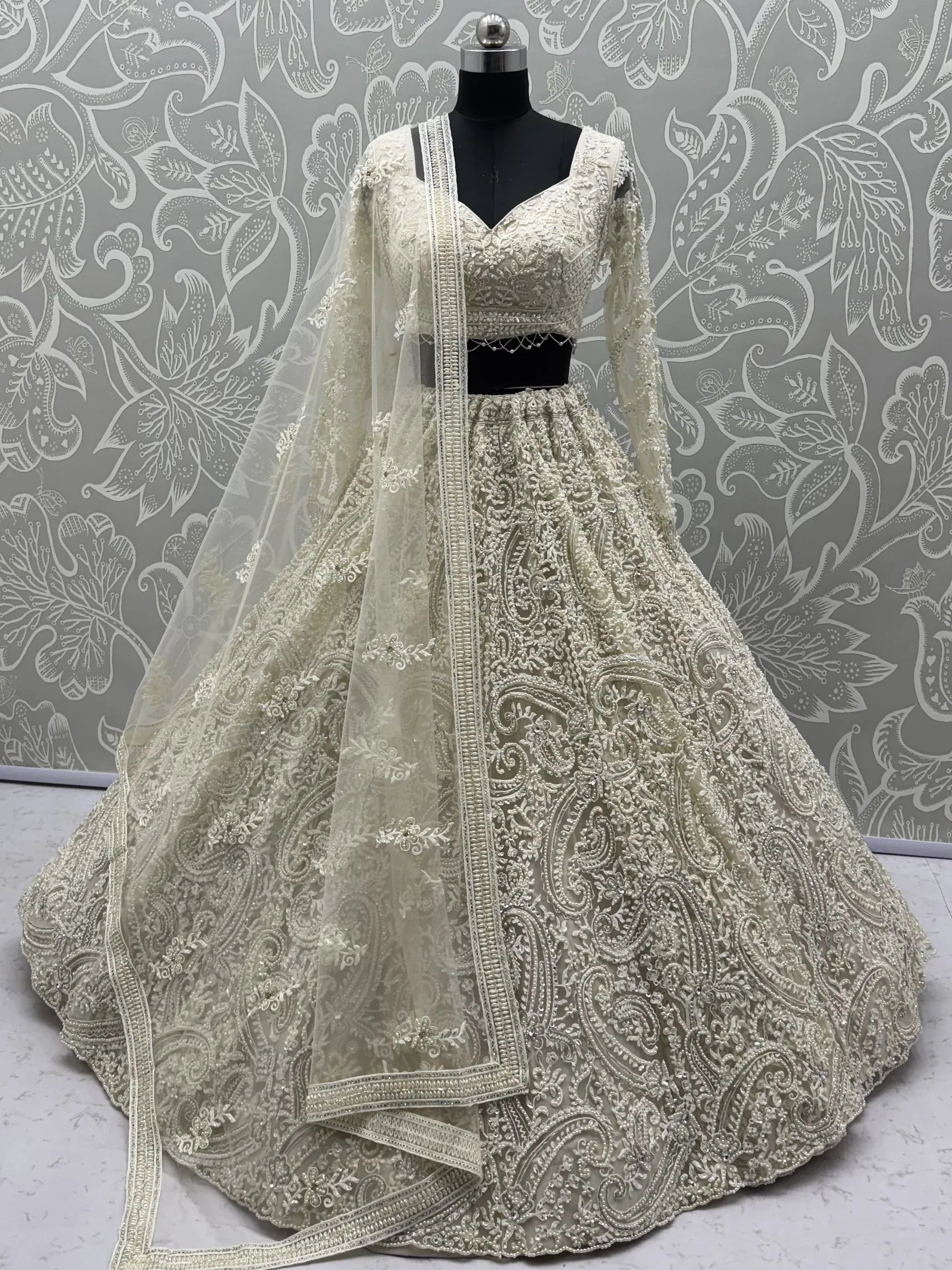 Monochrome White Hand Embroidered Net Wedding Wear Lehenga Choli