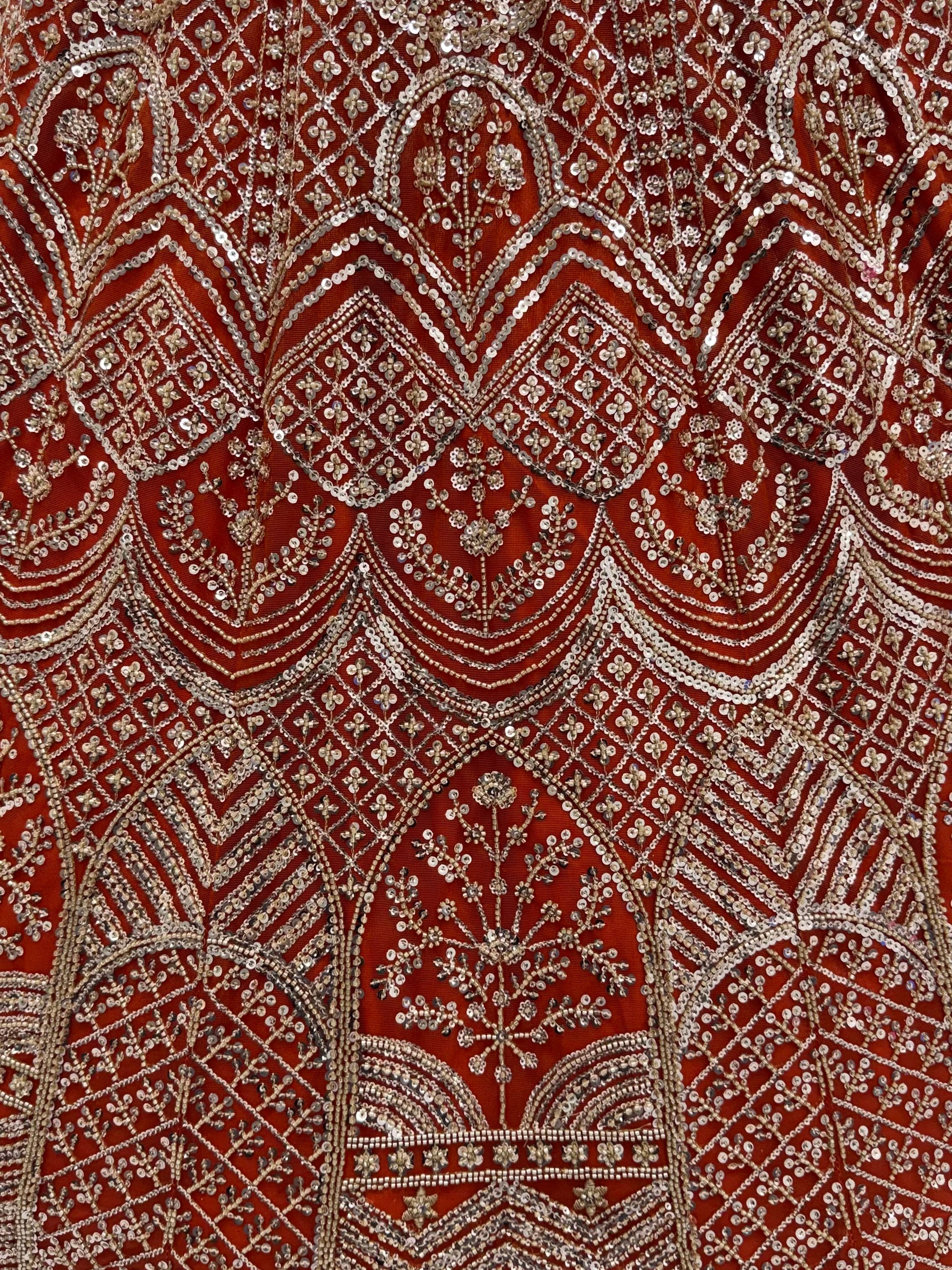 Wonderful Rust Orange Sequins Net Wedding Wear Lehenga Choli