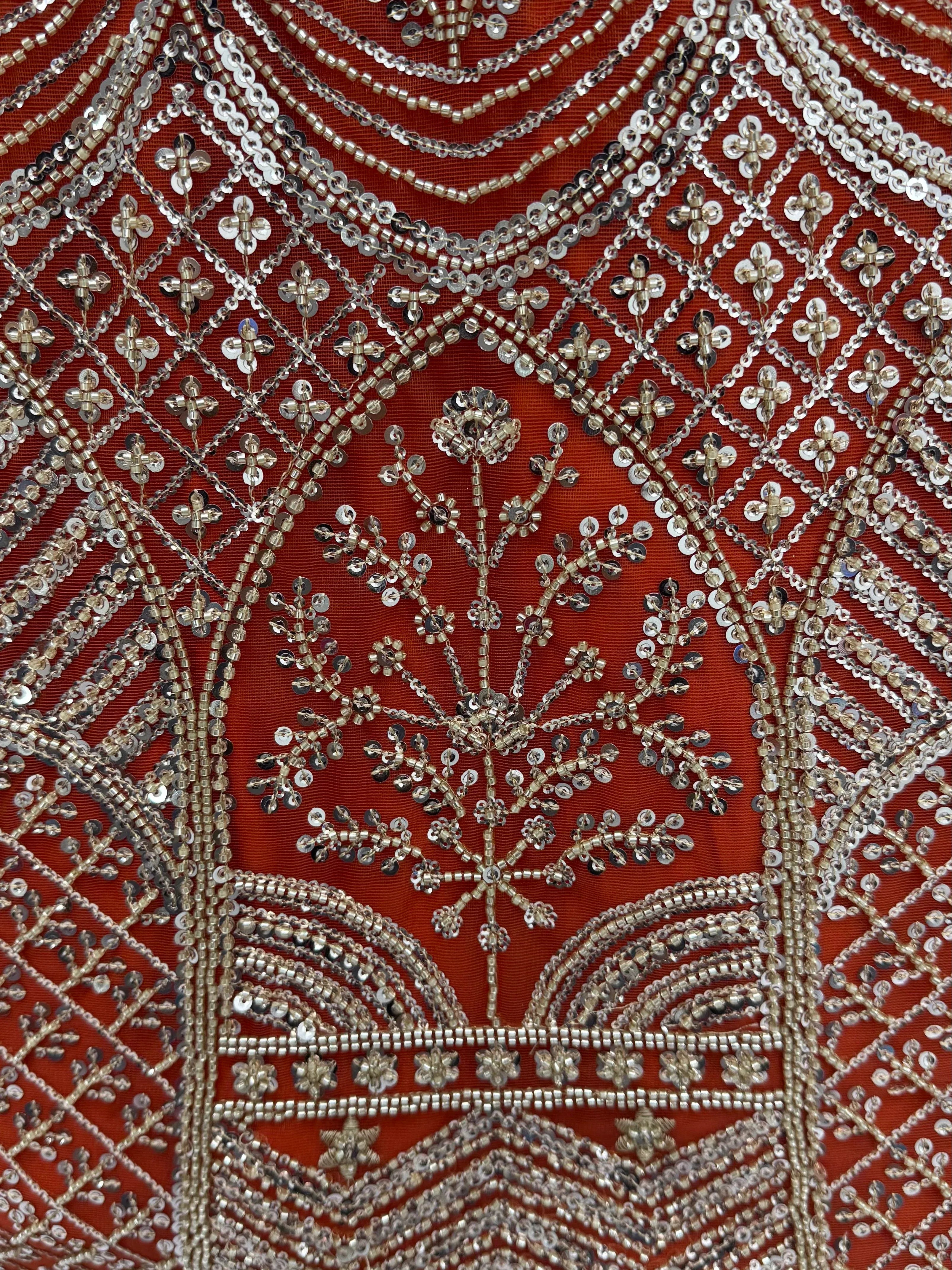 Wonderful Rust Orange Sequins Net Wedding Wear Lehenga Choli