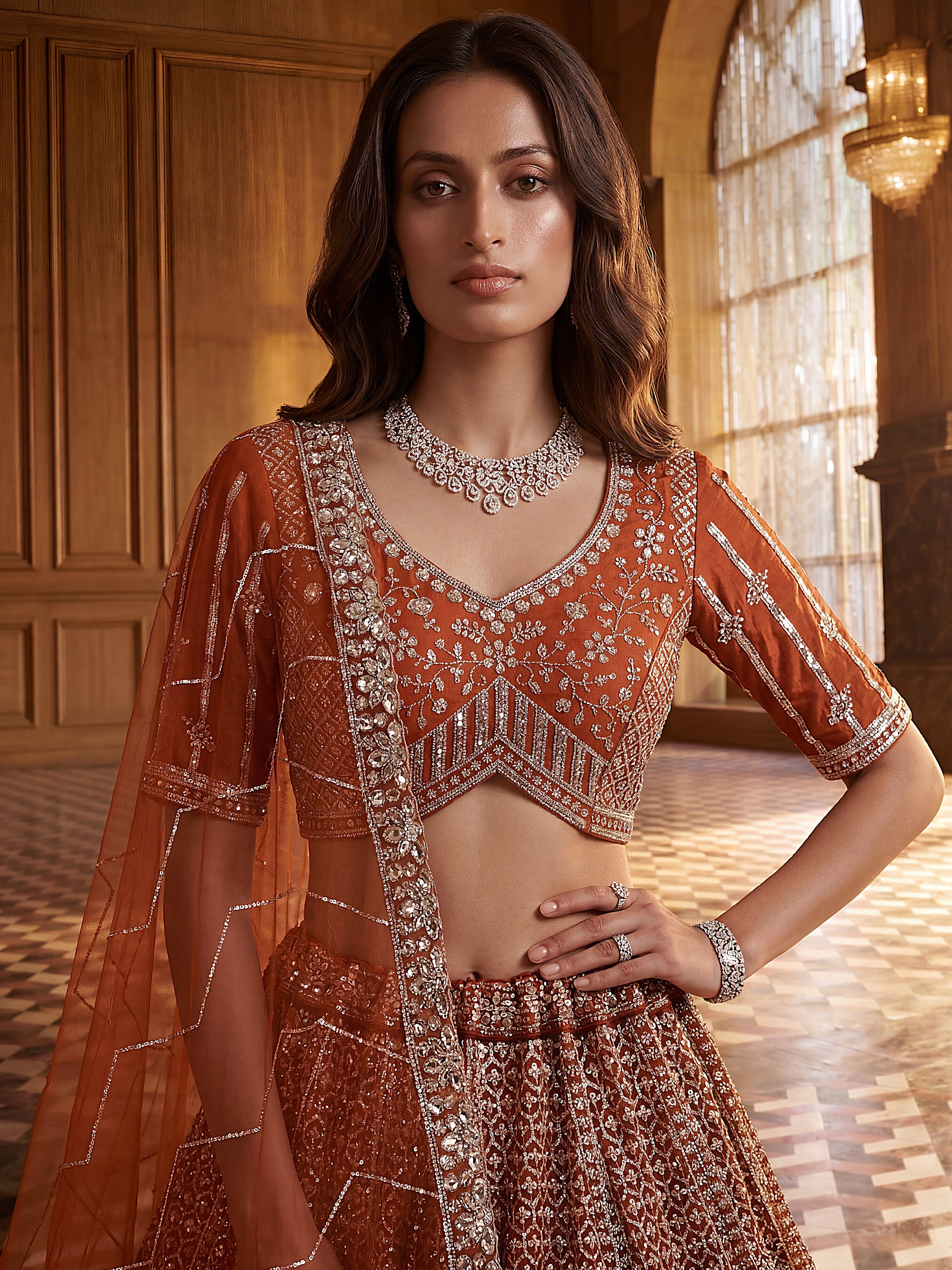 Wonderful Rust Orange Sequins Net Wedding Wear Lehenga Choli