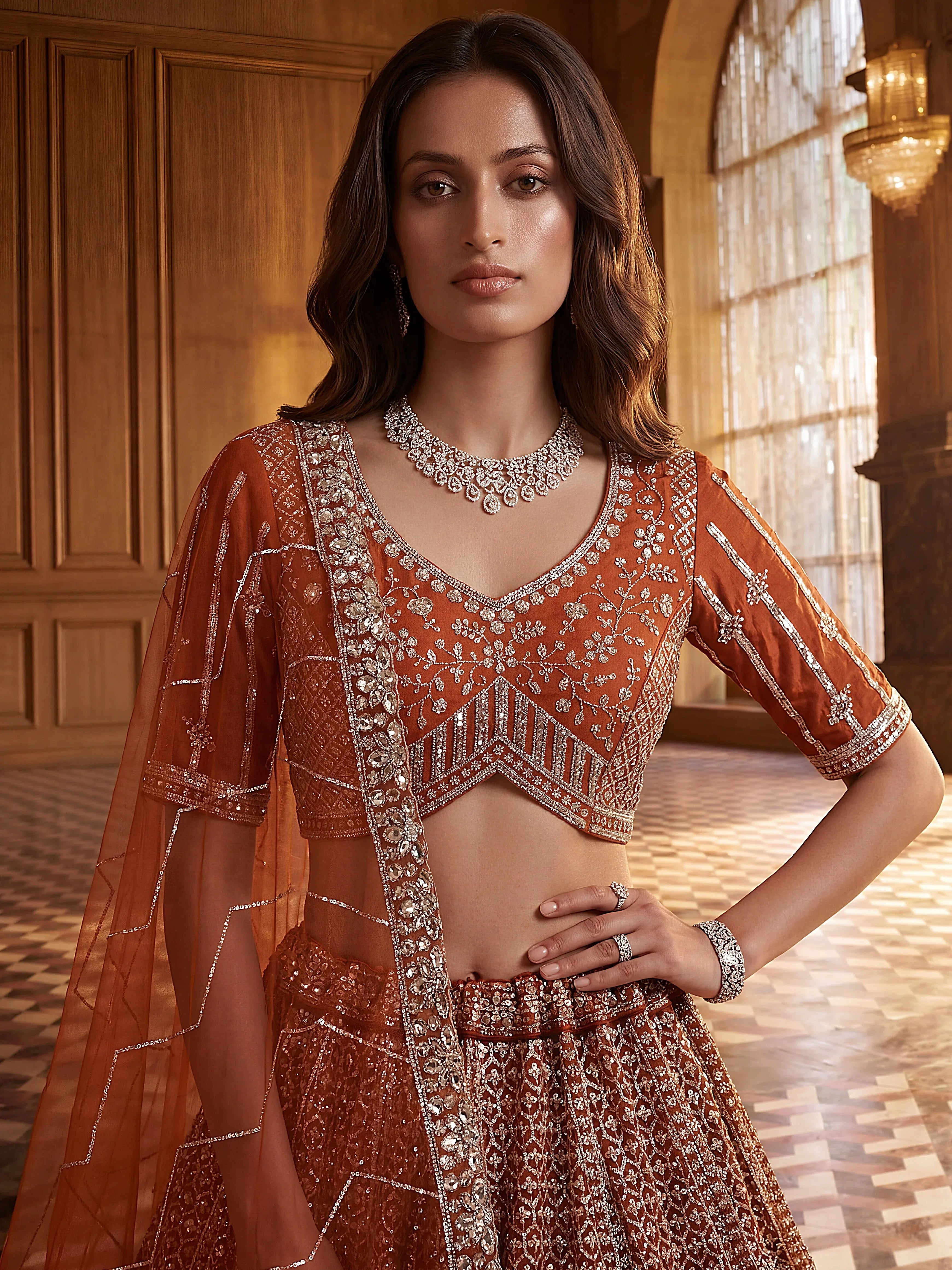 Wonderful Rust Orange Sequins Net Wedding Wear Lehenga Choli