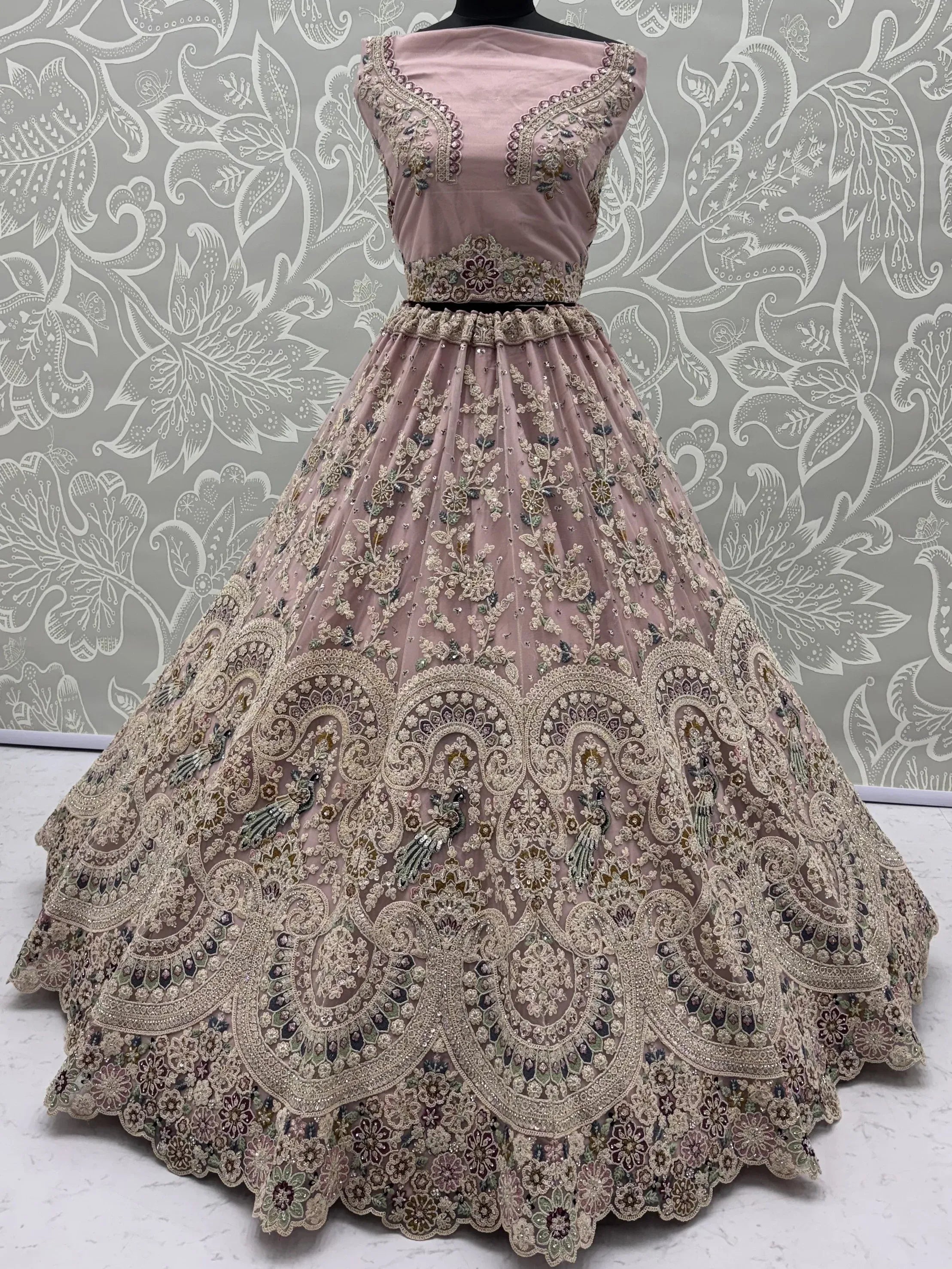 Lavish Dusty Pink Thread Embroidered Net Engagement Wear Lehenga Choli