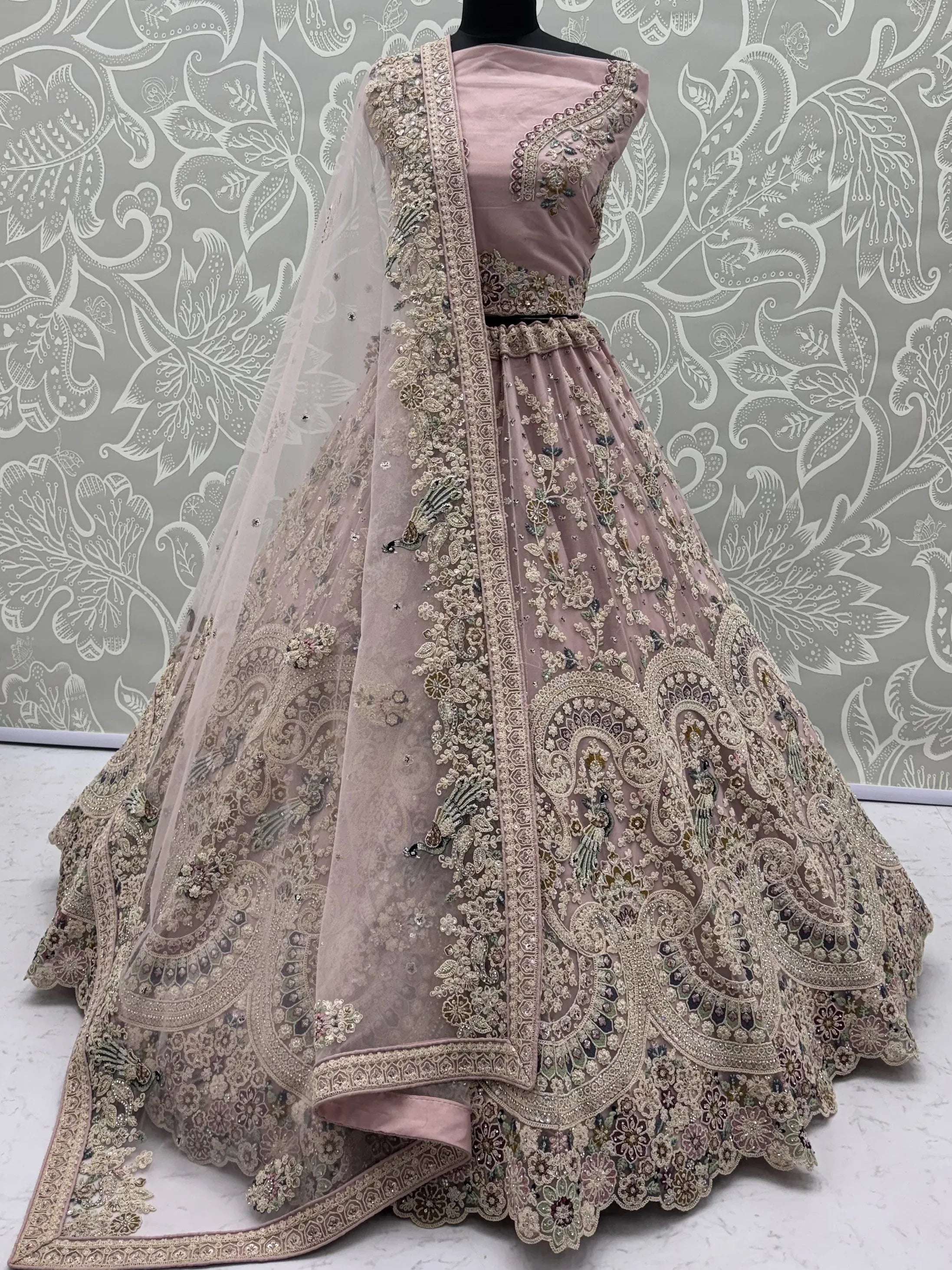 Lavish Dusty Pink Thread Embroidered Net Engagement Wear Lehenga Choli