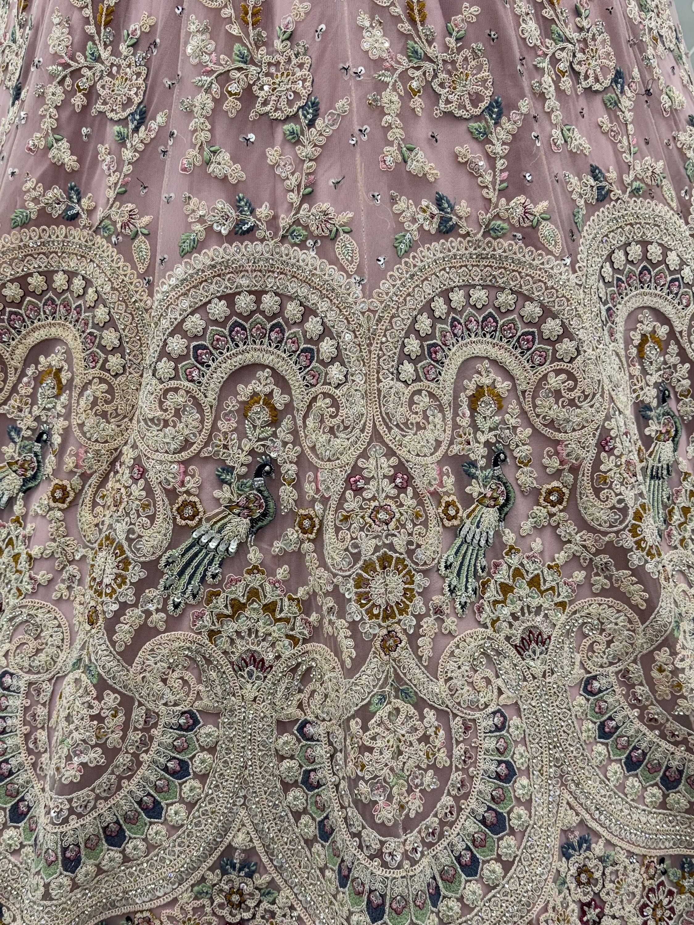 Lavish Dusty Pink Thread Embroidered Net Engagement Wear Lehenga Choli