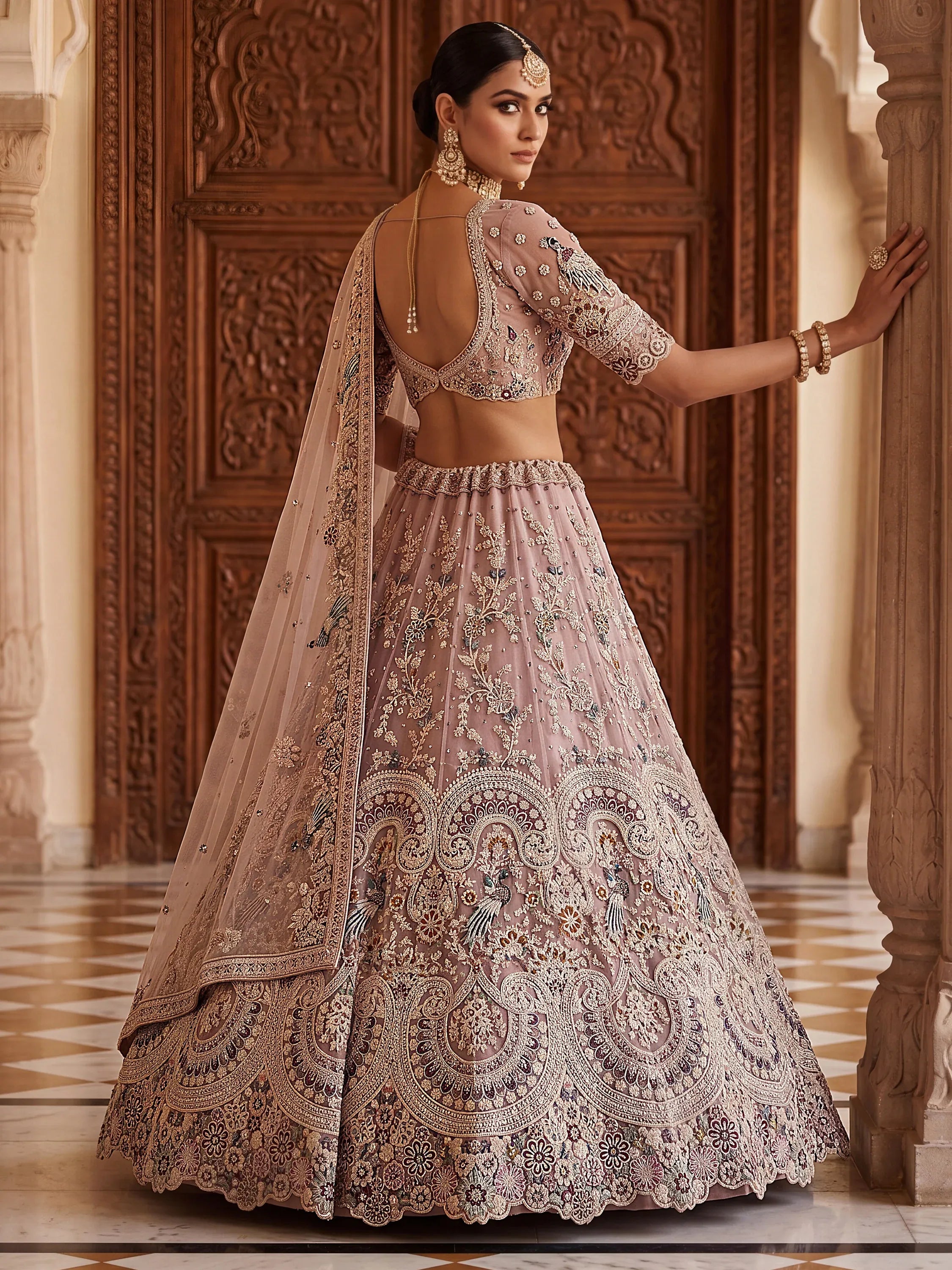 Lavish Dusty Pink Thread Embroidered Net Engagement Wear Lehenga Choli