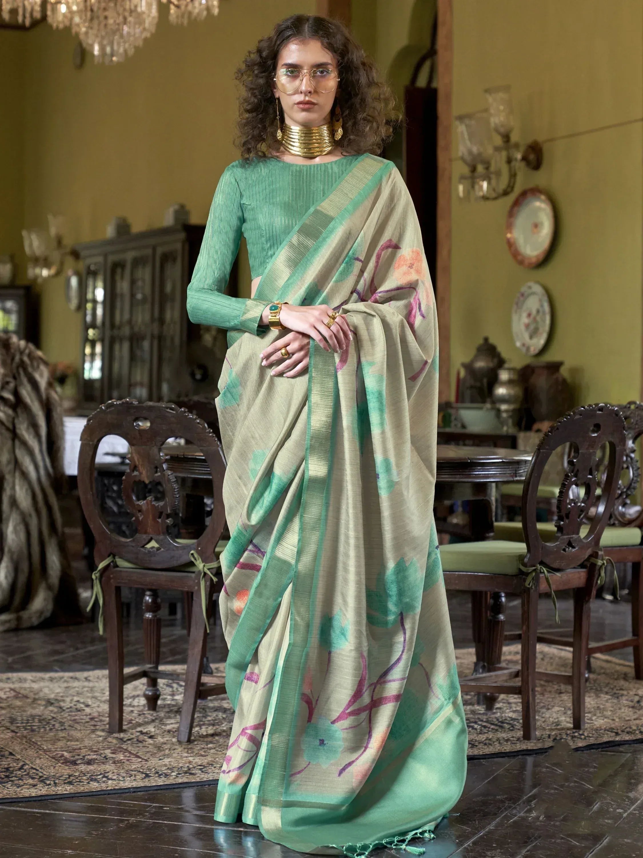Woman in elegant green floral saree with matching blouse, traditional Indian ethnic wear