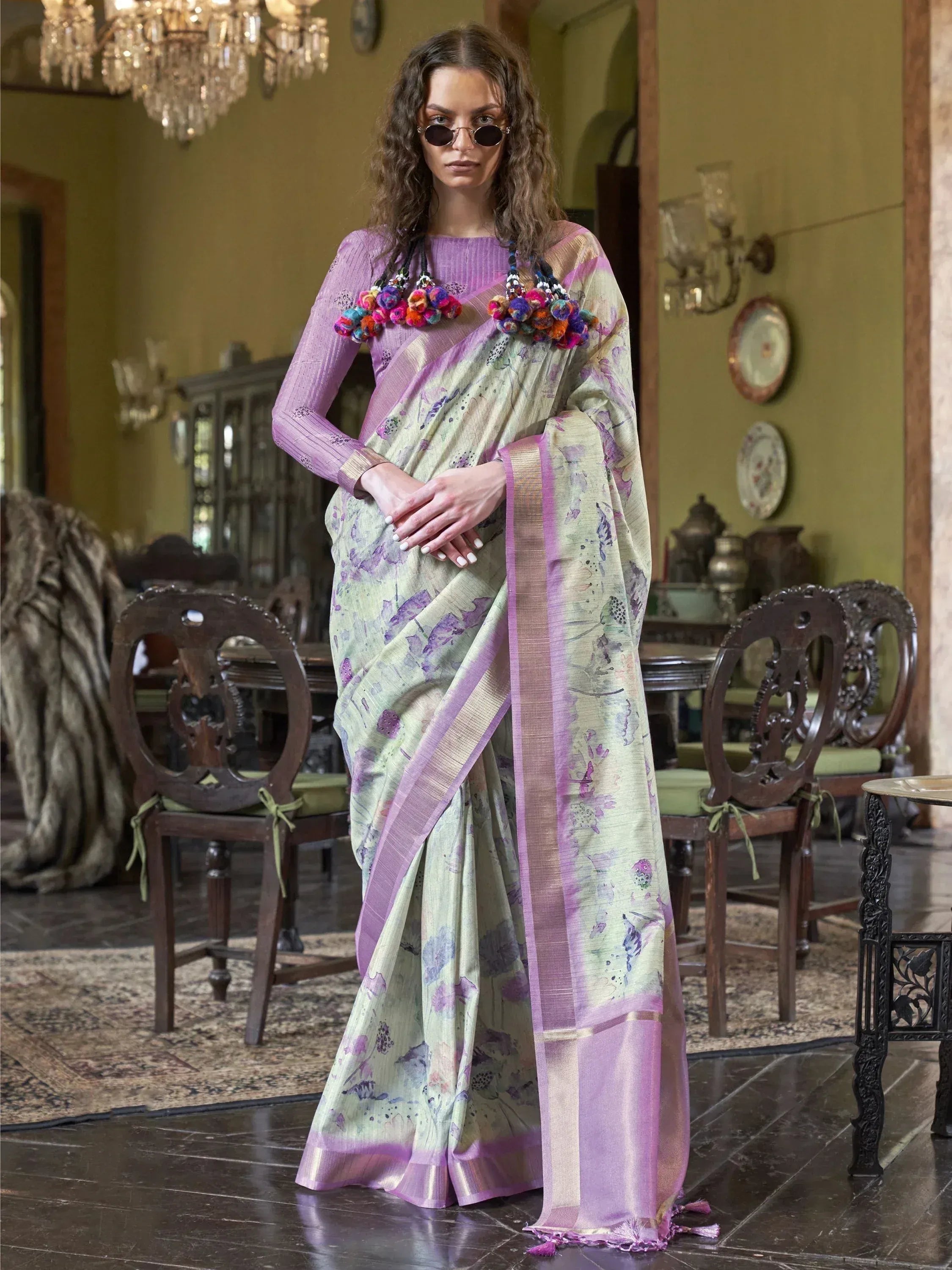 Woman in floral print saree with purple border and pom-pom blouse, Indian ethnic wear