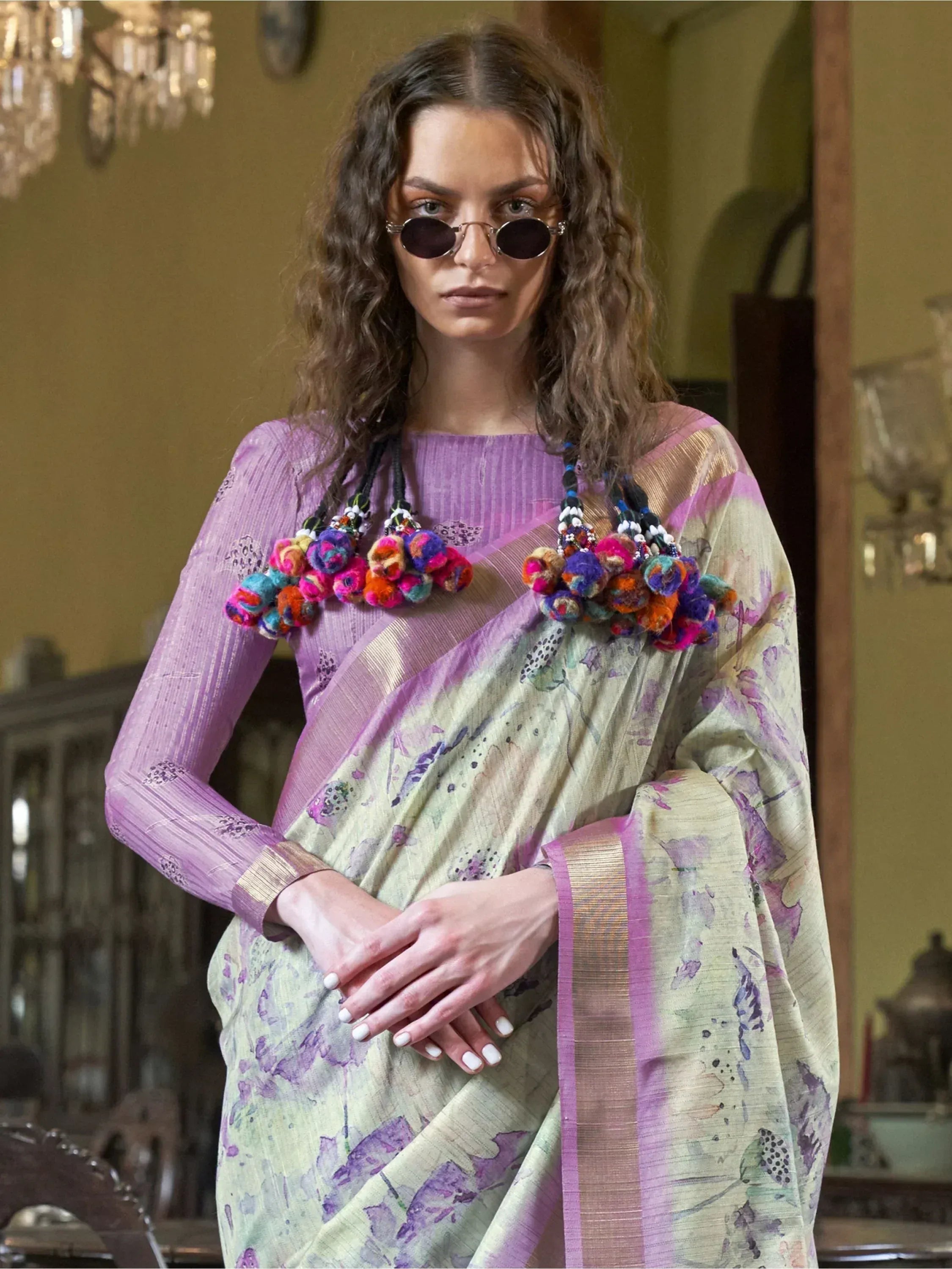 Woman in purple floral saree with pom-pom blouse, stylish ethnic wear for women
