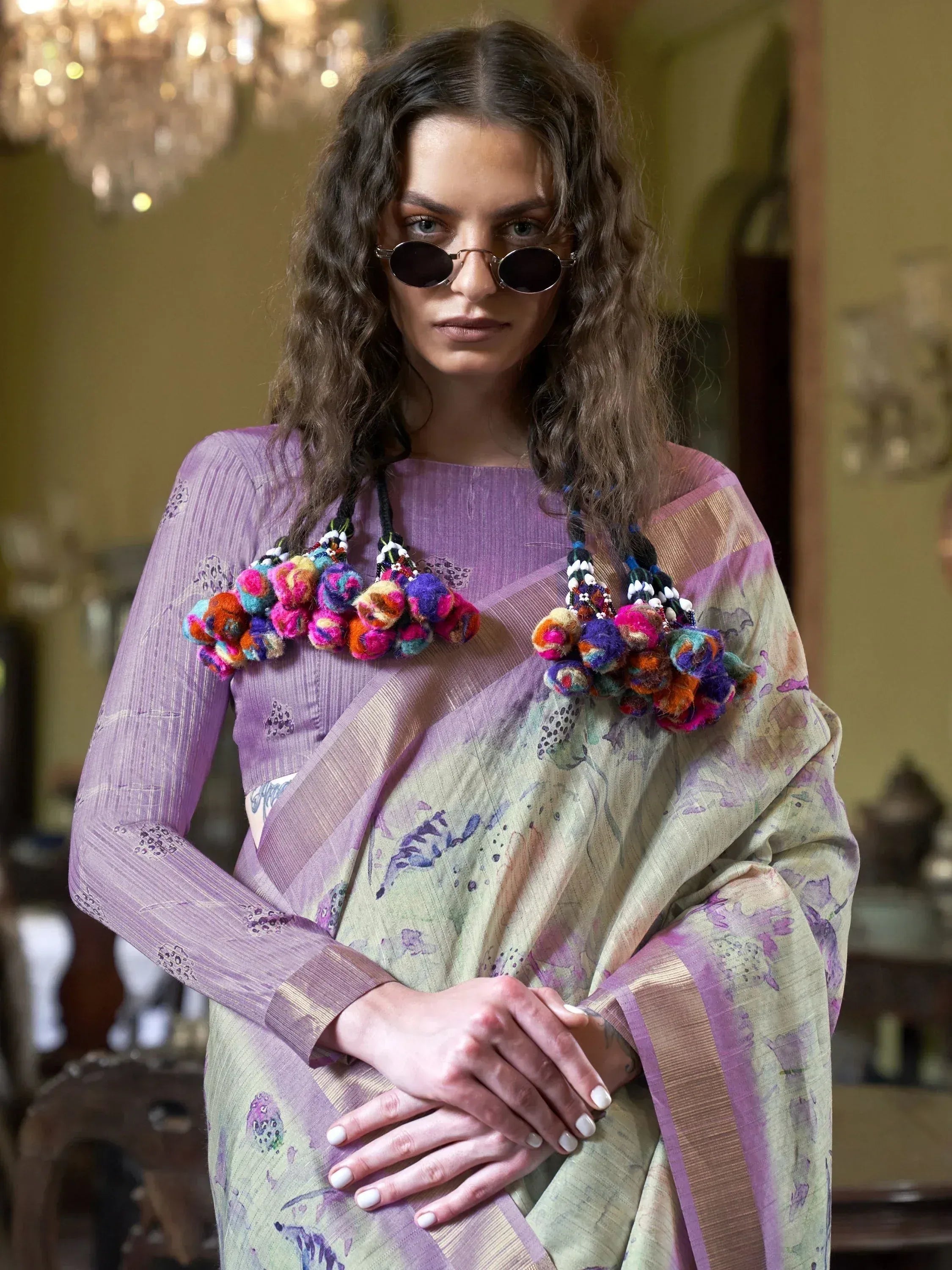 Woman in purple floral saree with colorful pom-pom dupatta, stylish ethnic wear for women