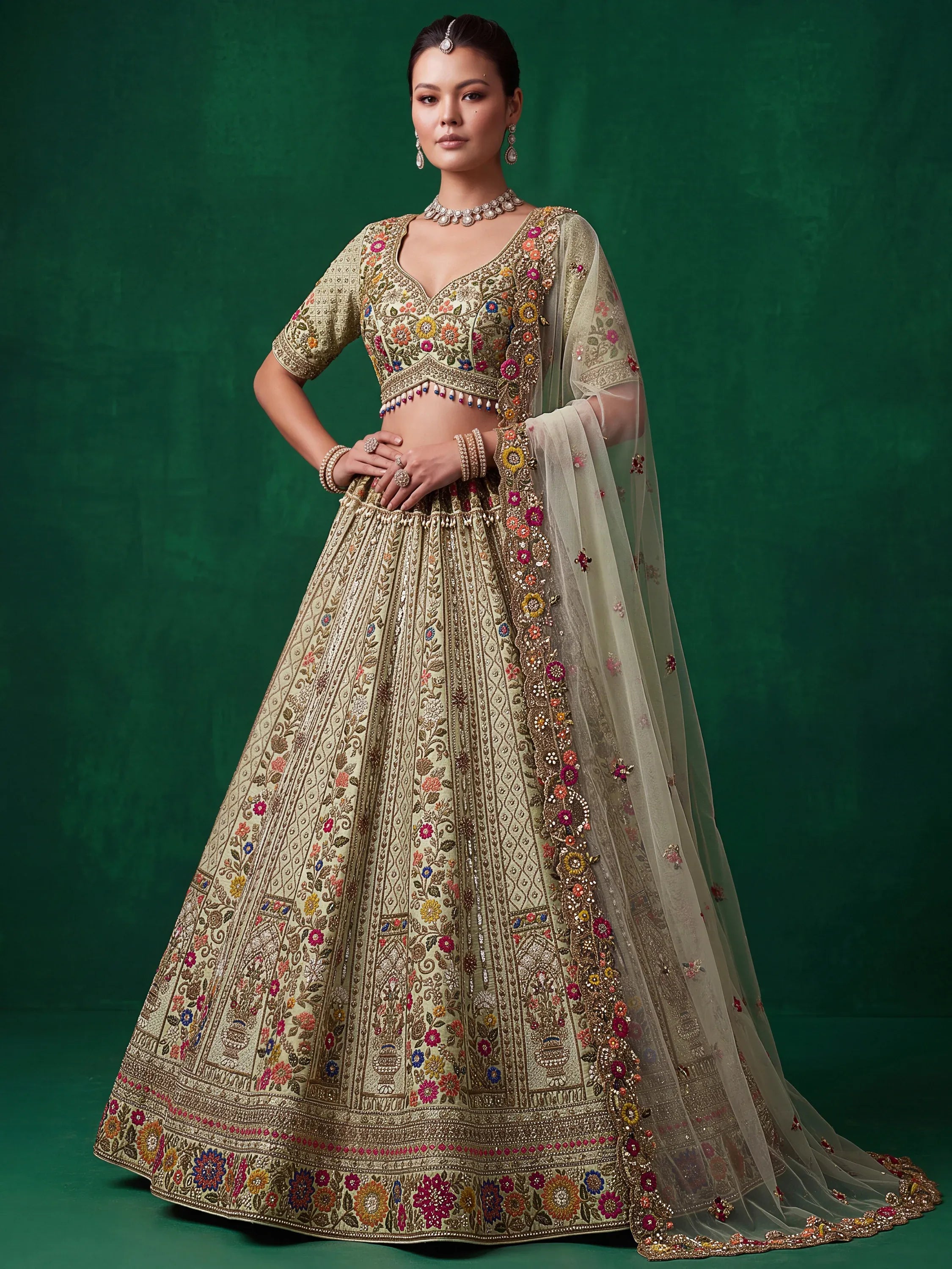 Luxurious Pista Green Hand Embroidered Silk Reception Wear Lehenga Choli
