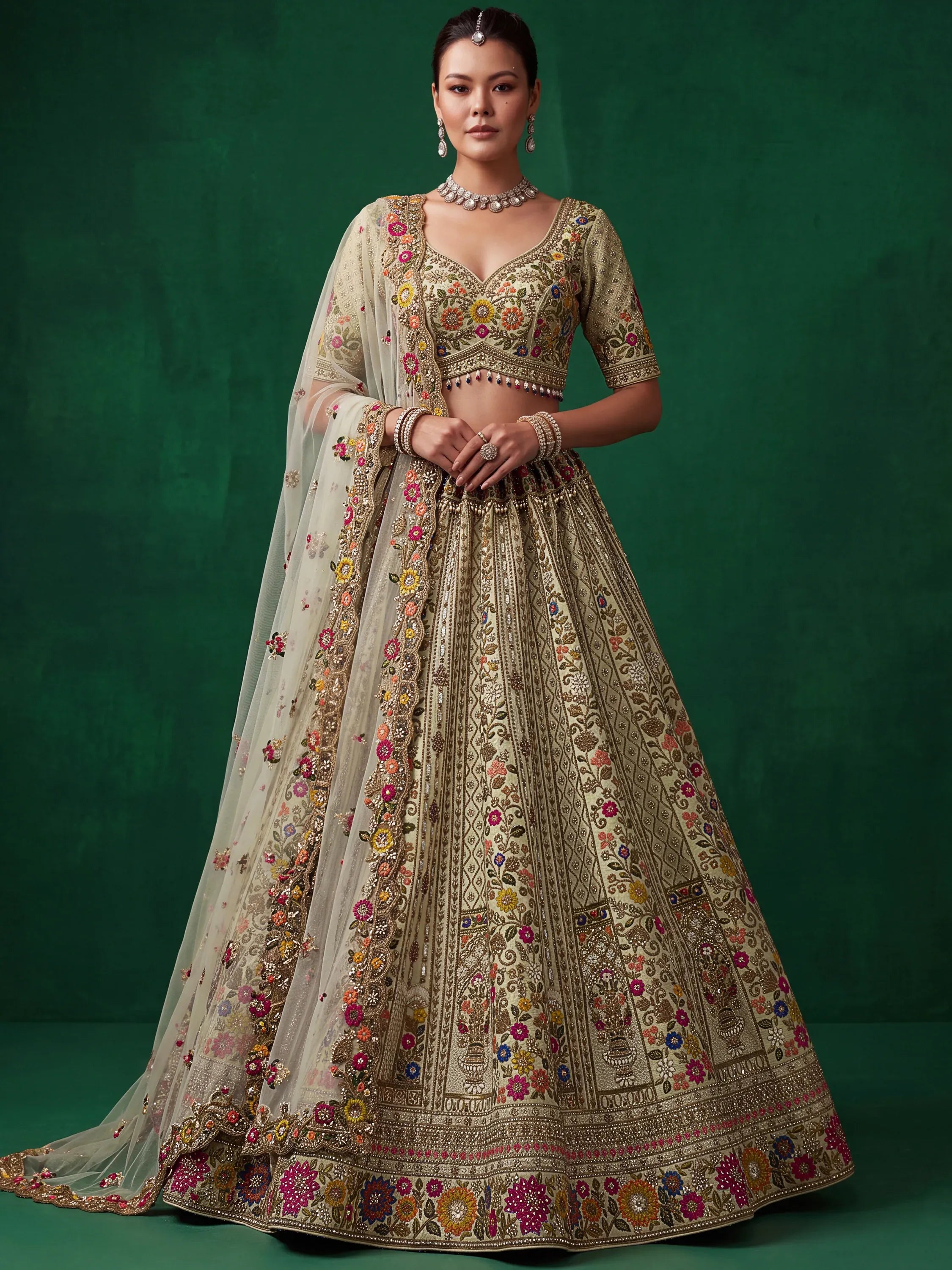 Luxurious Pista Green Hand Embroidered Silk Reception Wear Lehenga Choli