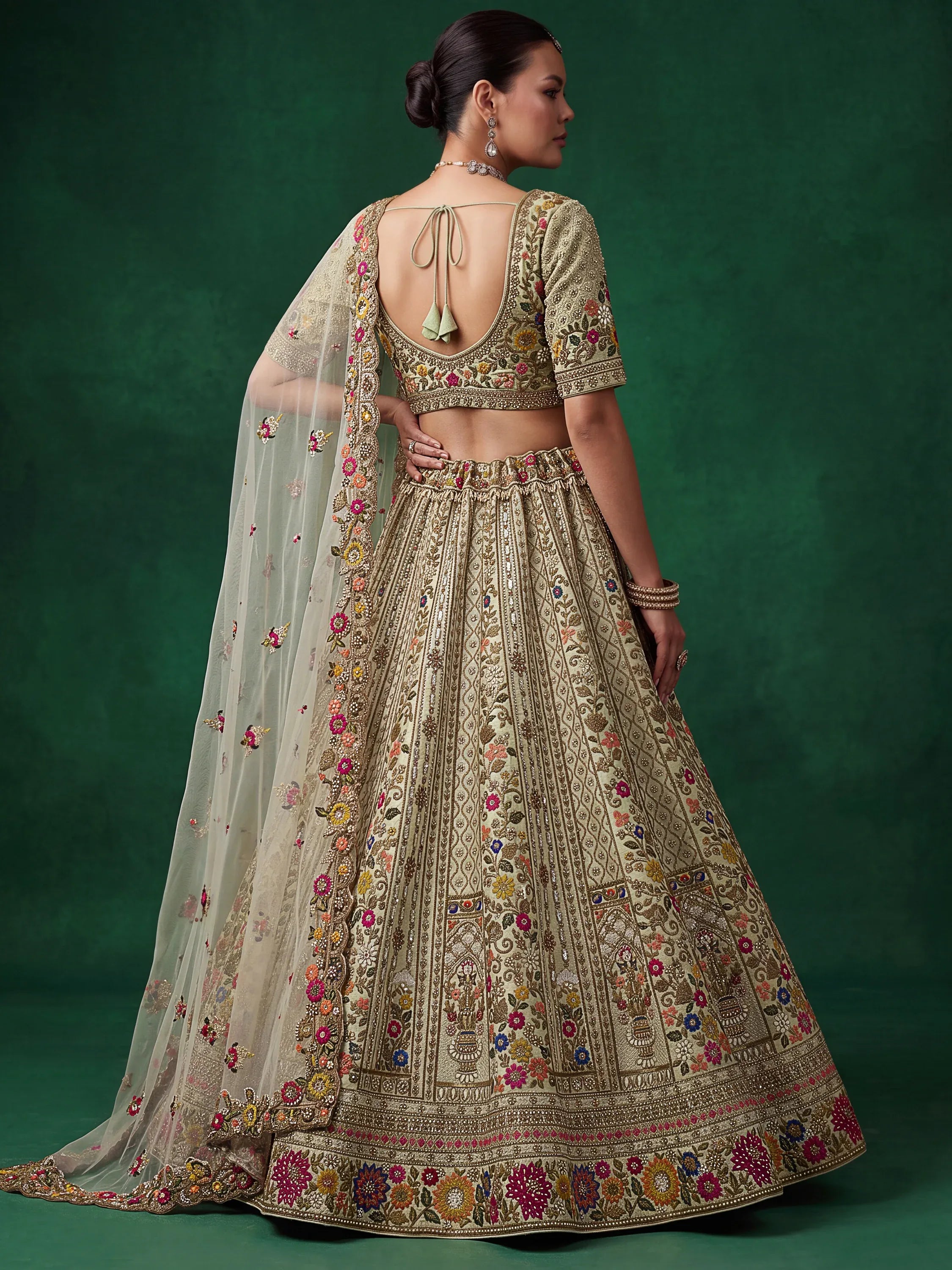 Luxurious Pista Green Hand Embroidered Silk Reception Wear Lehenga Choli