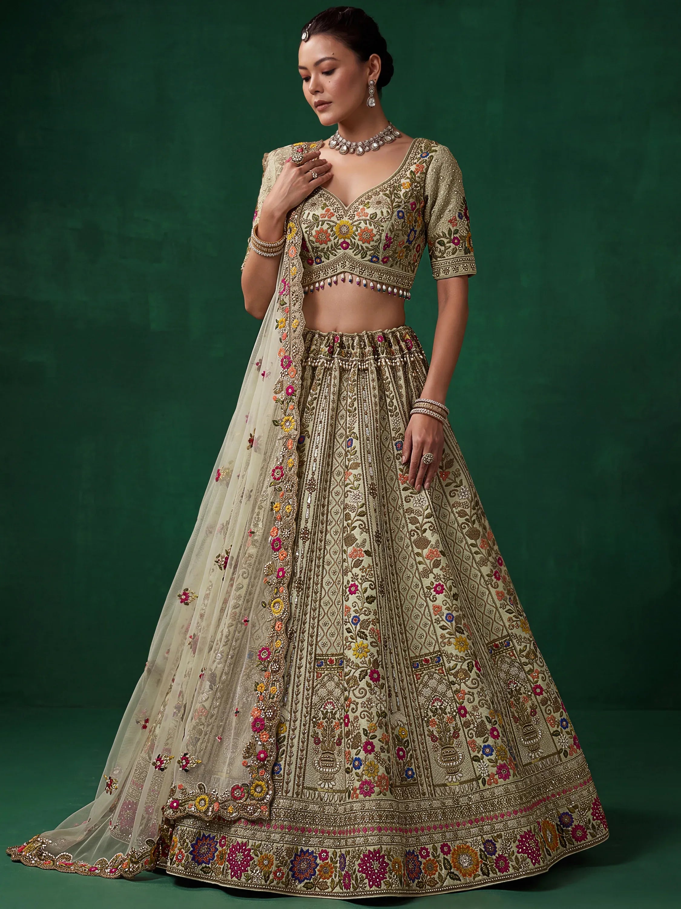 Luxurious Pista Green Hand Embroidered Silk Reception Wear Lehenga Choli
