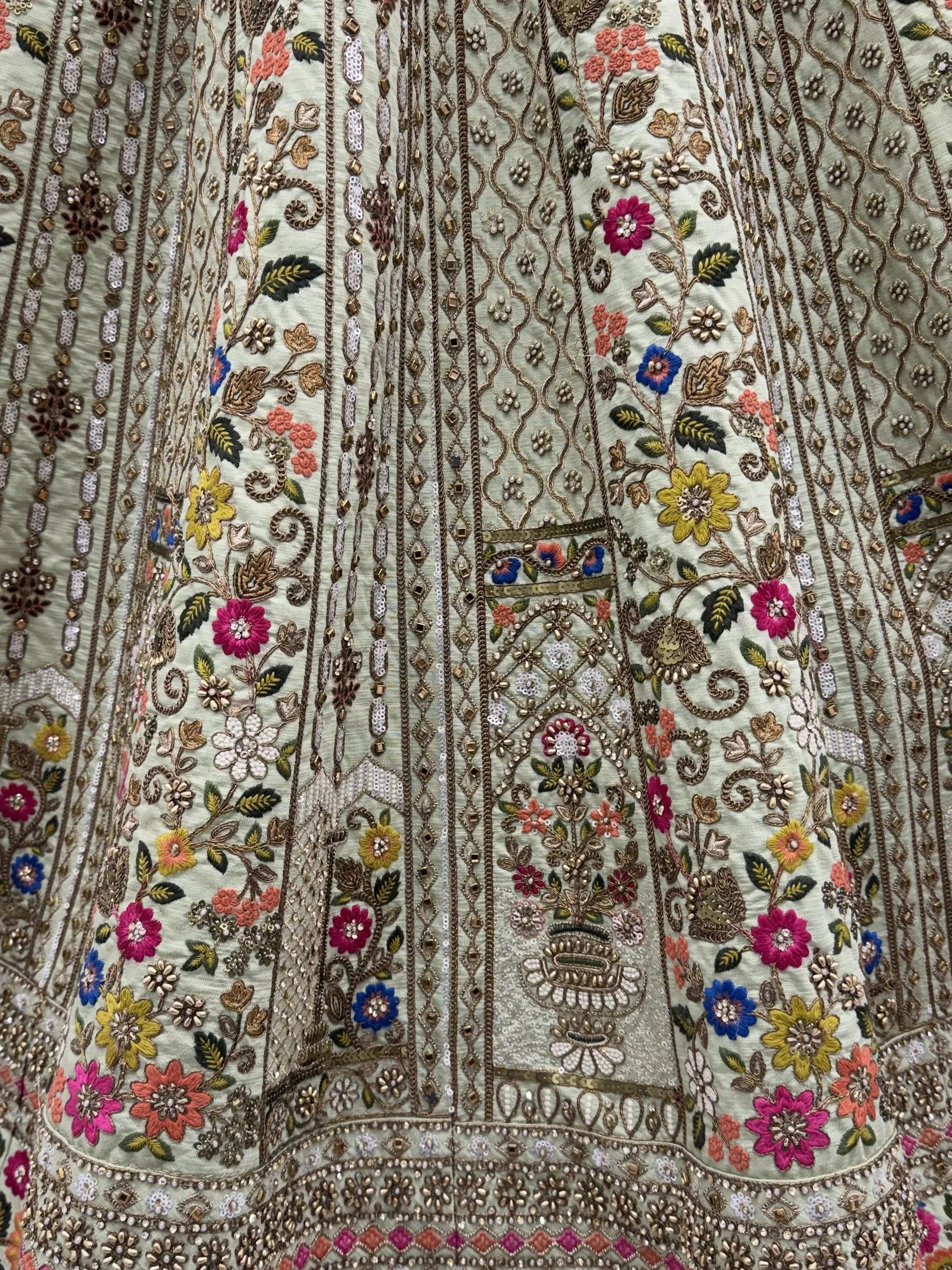Luxurious Pista Green Hand Embroidered Silk Reception Wear Lehenga Choli