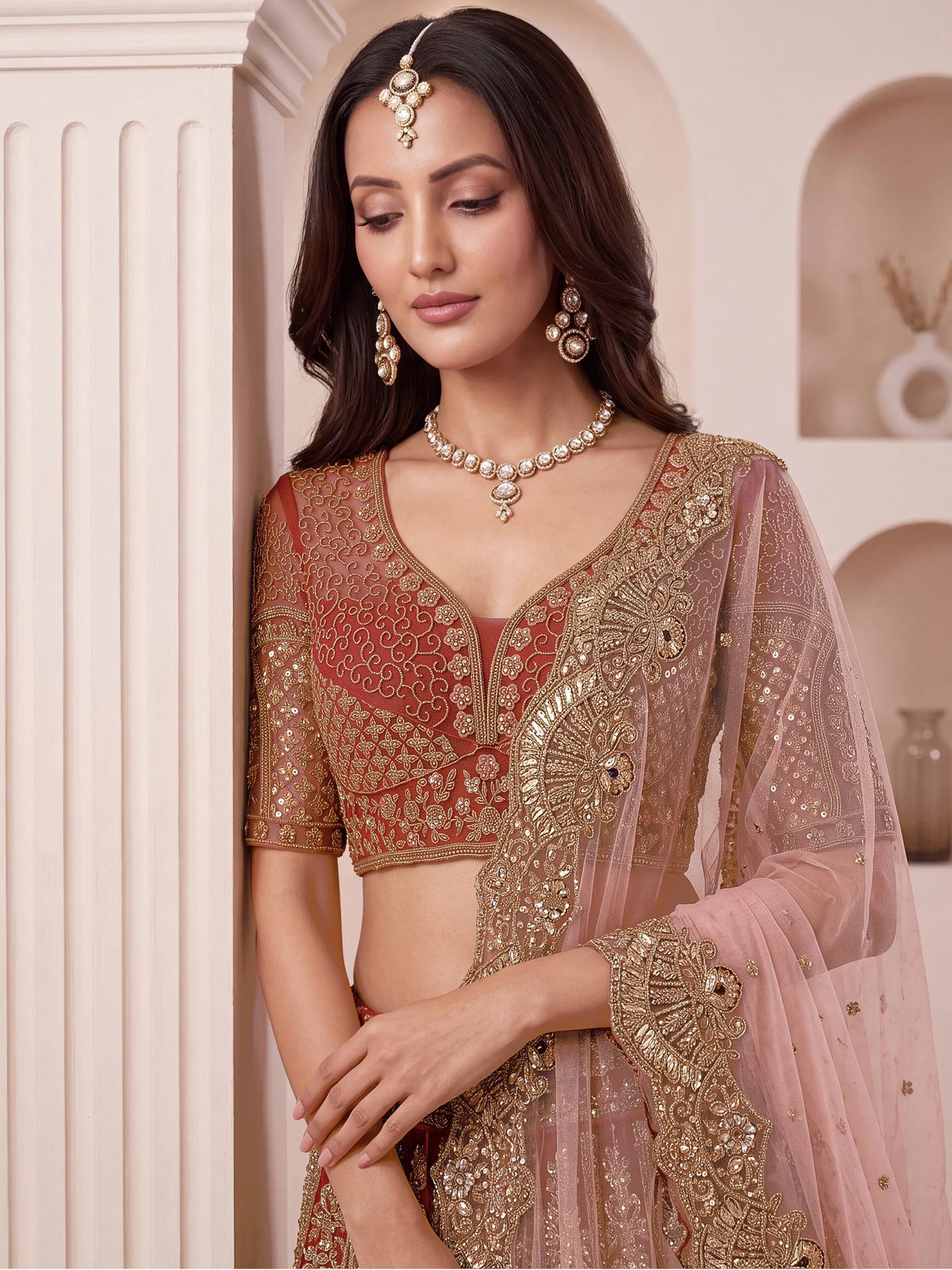 Regal Rust Pink Zircon Work Net Wedding Wear Lehenga With Blouse