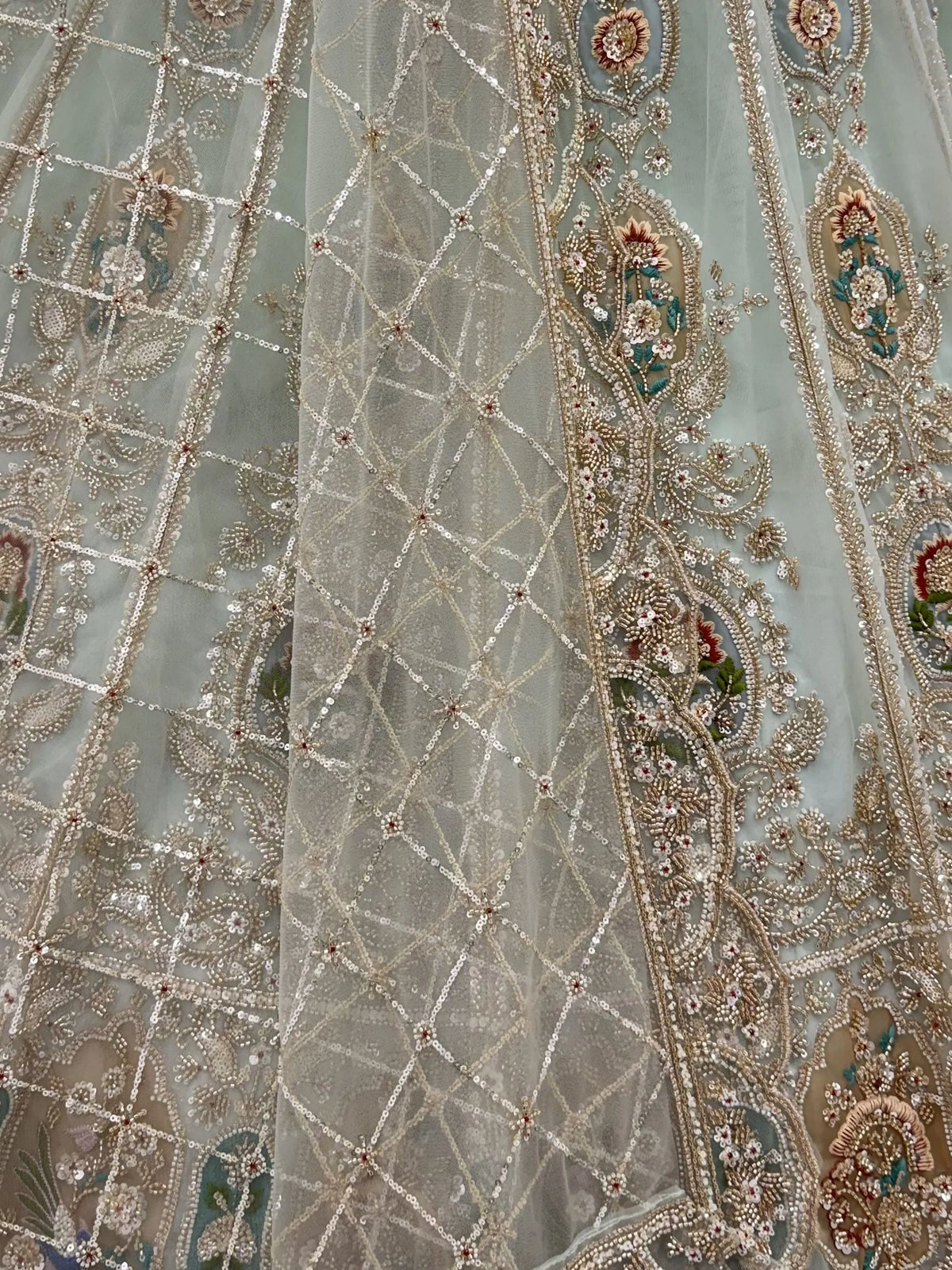 Rich Mint Green Heavy Embroidered Net Reception Wear Lehenga Choli
