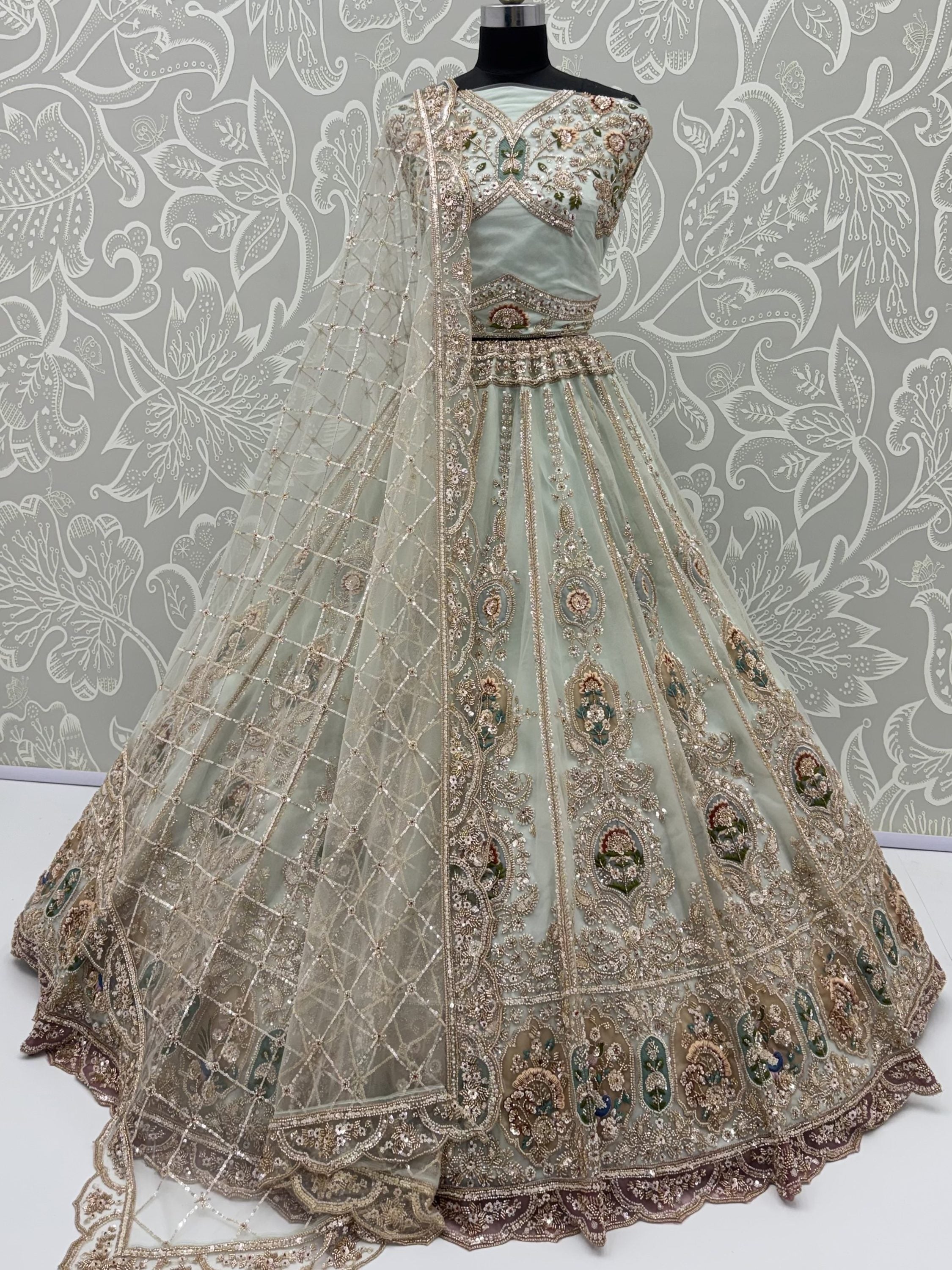 Rich Mint Green Heavy Embroidered Net Reception Wear Lehenga Choli