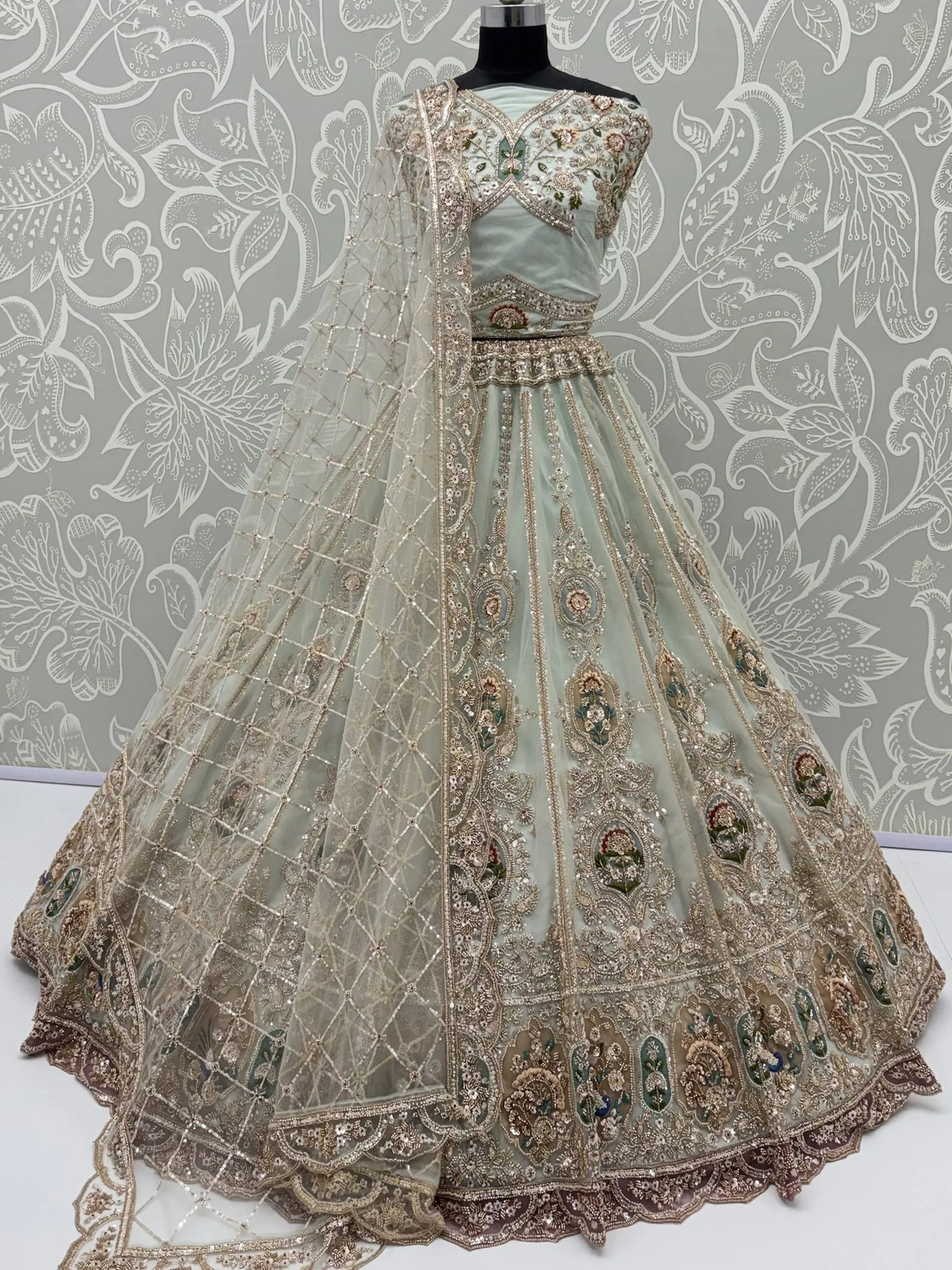 Rich Mint Green Heavy Embroidered Net Reception Wear Lehenga Choli
